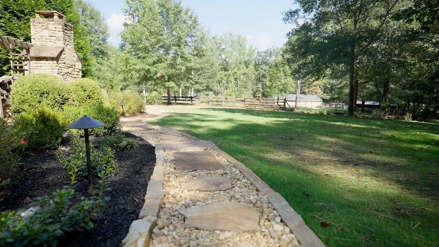 Shaded lawn and planting layout designed for Georgia climate in East Cobb, GA