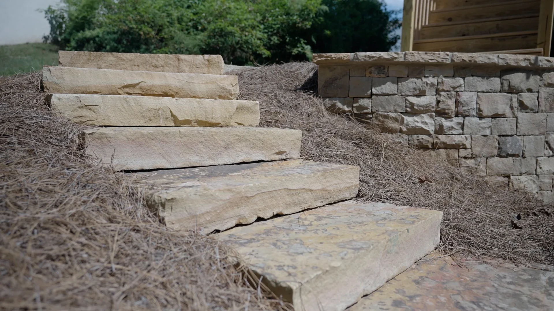 Stone retaining wall steps built for erosion control in an Atlanta, GA backyard