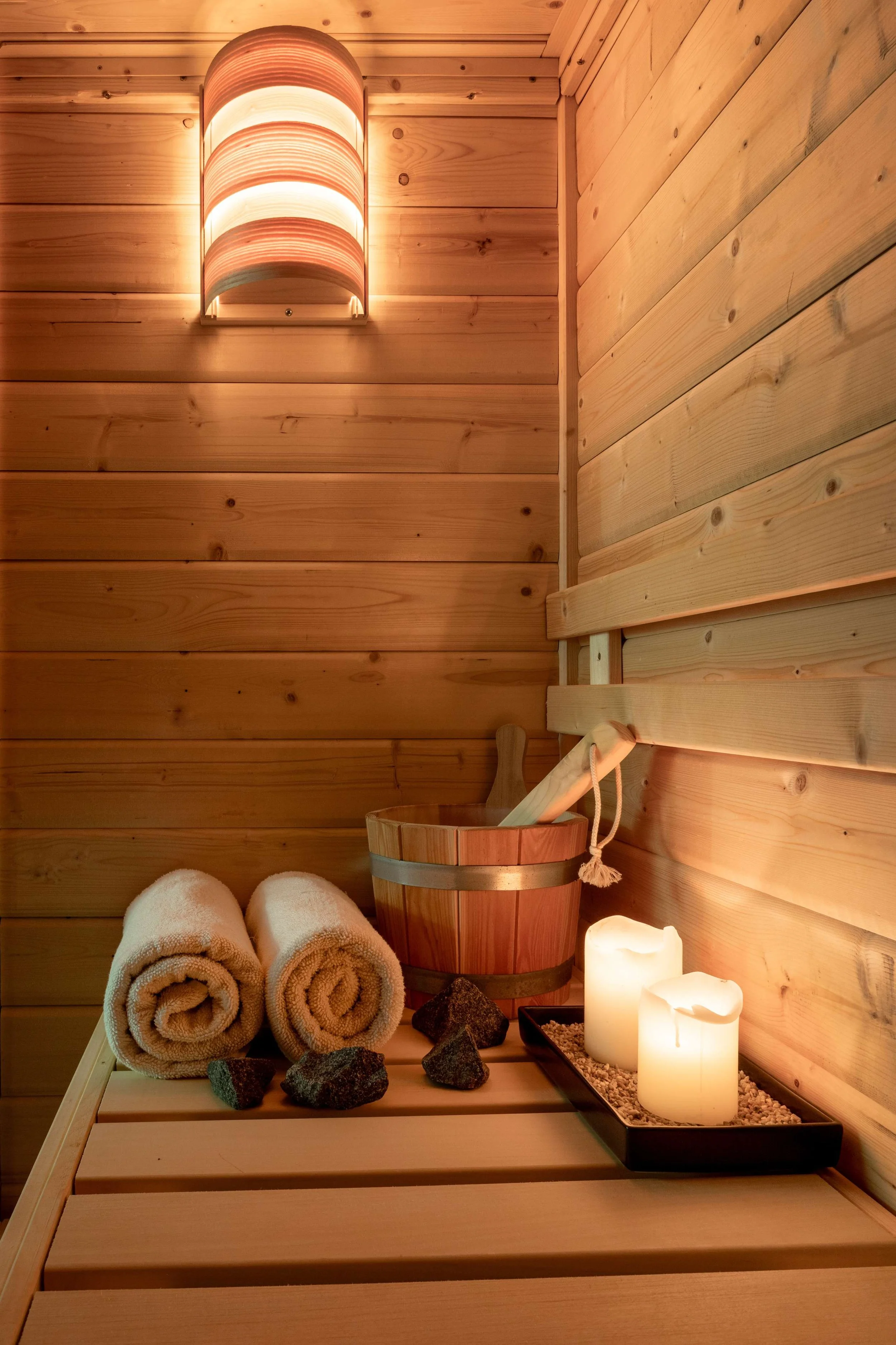 inside of a sauna room with a lightwood design