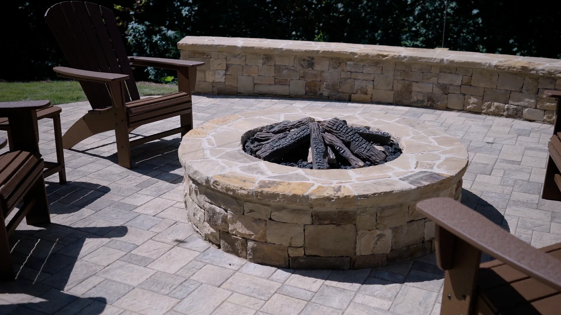 Fire pit and patio combination integrated into backyard landscape design in Atlanta, GA