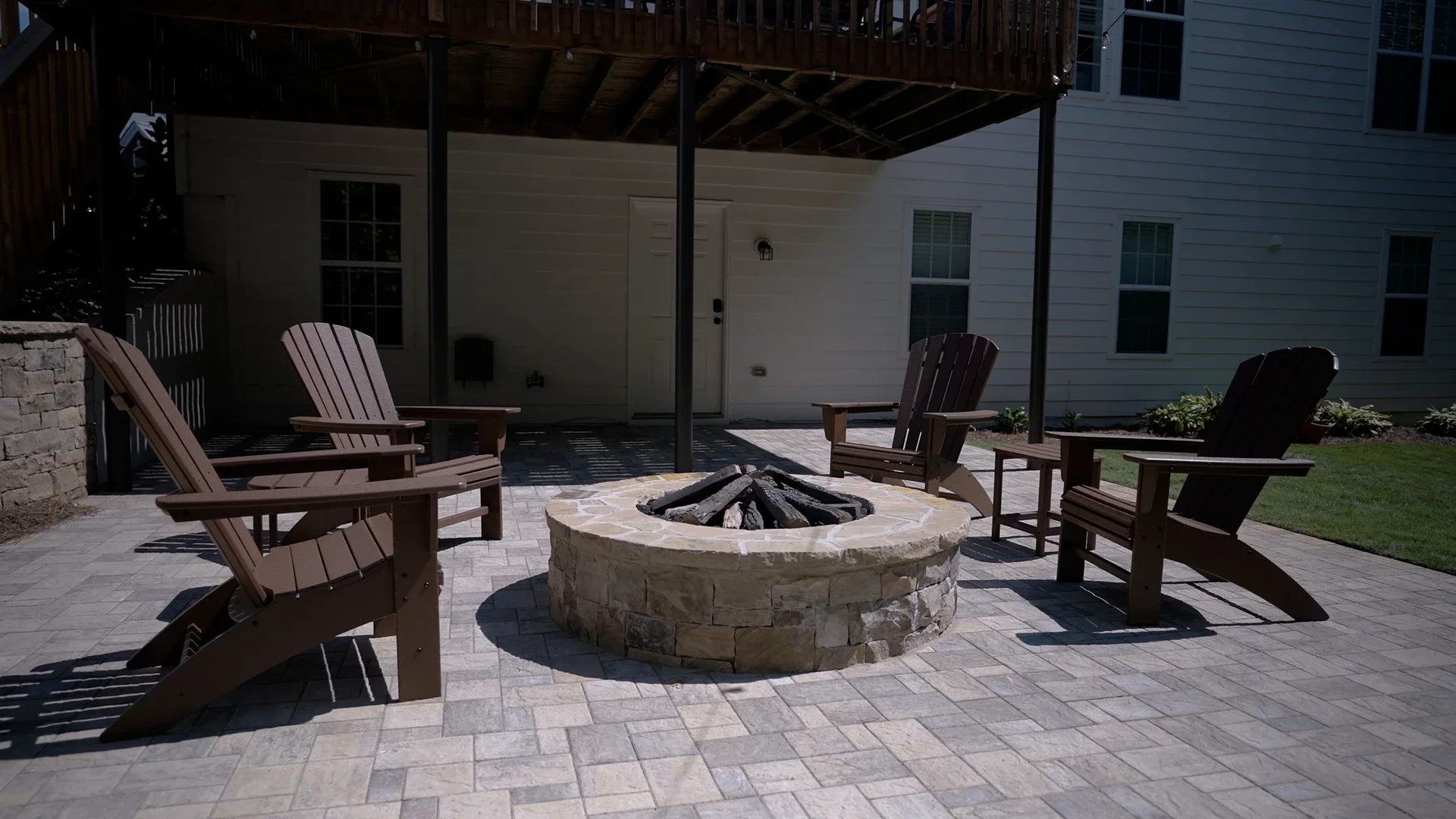 Stone patio seating area designed for everyday family use in Atlanta, GA