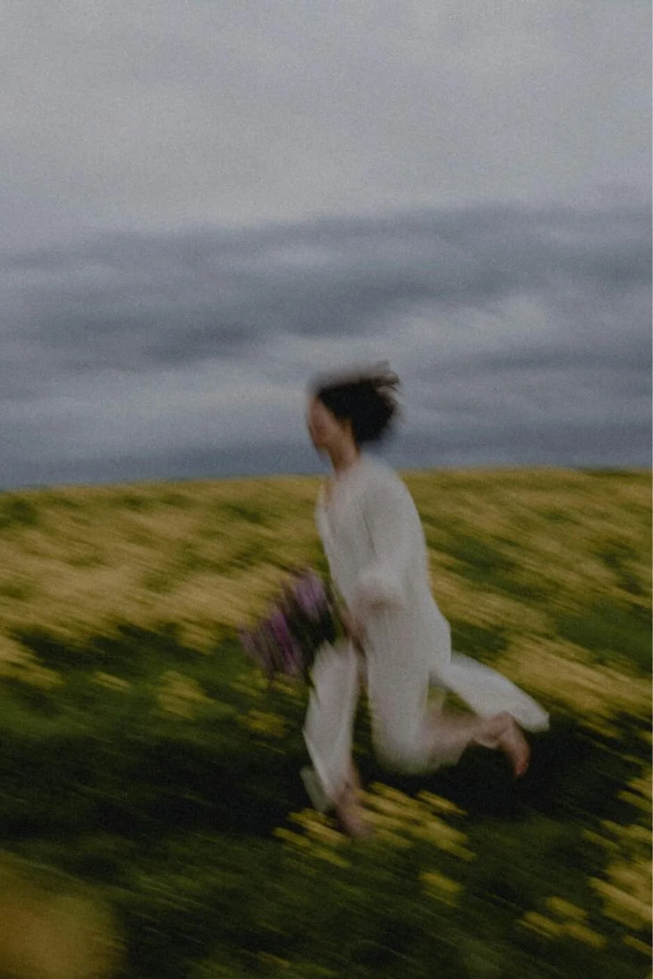 Woman running through a field with flowers, symbolizing moving forward through depression therapy.