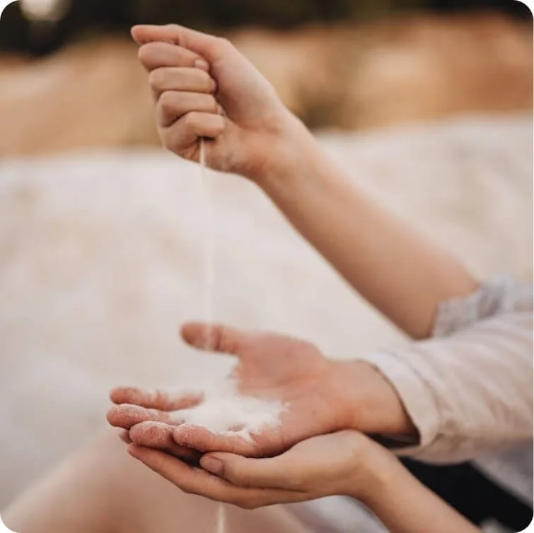 Hands offering support, symbolizing connection and care during trauma therapy.