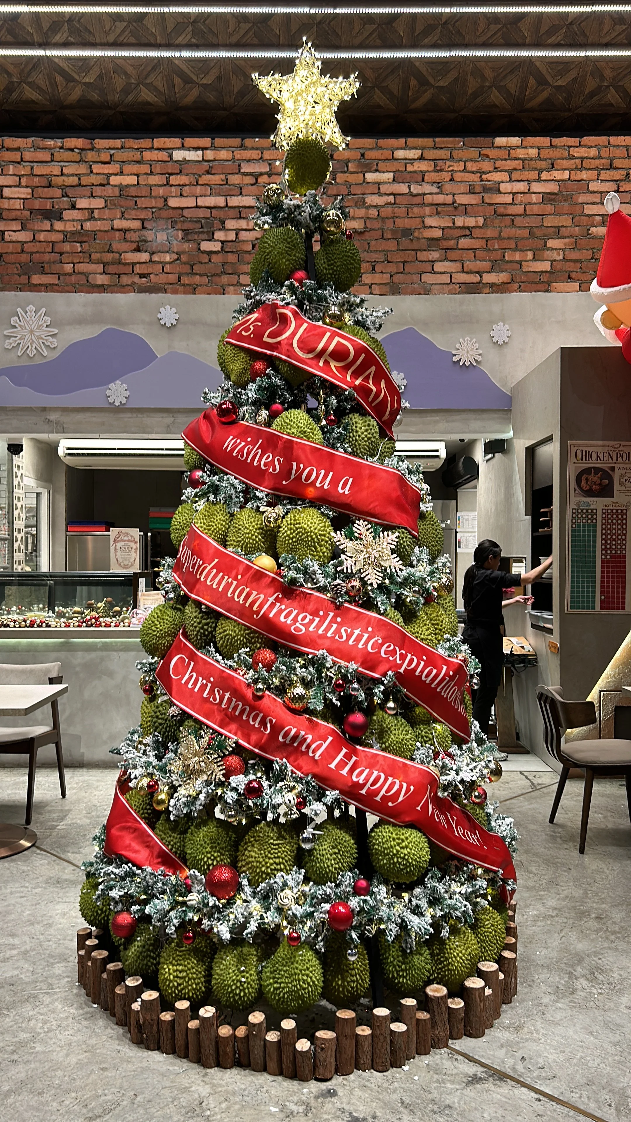 huge durian christmas tree placed in the middle of the cafe