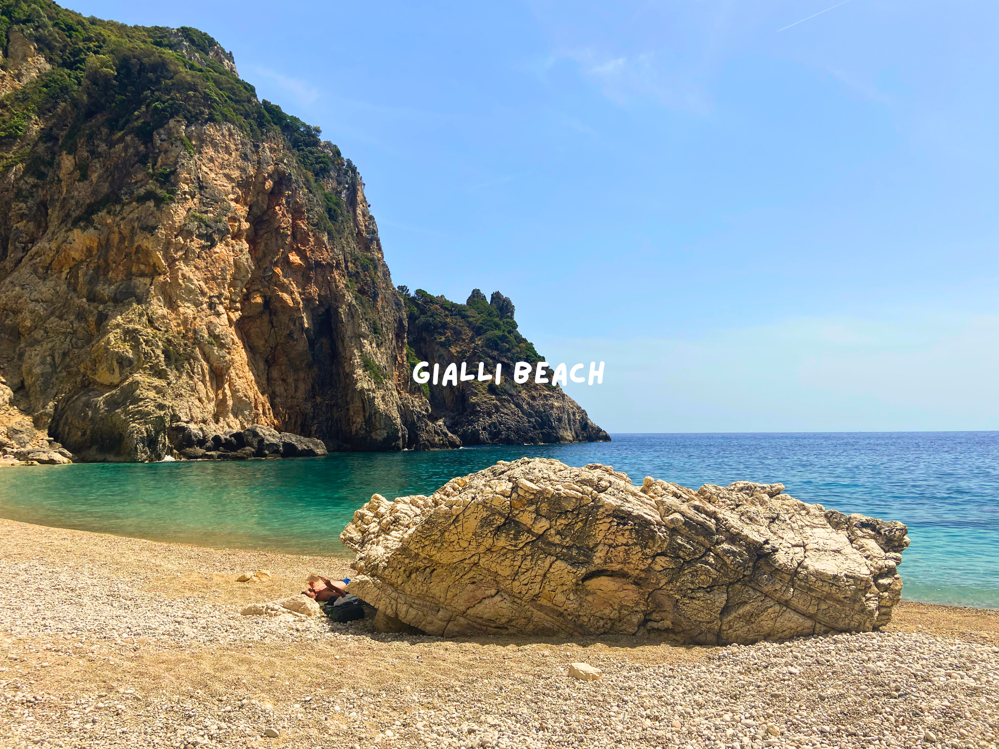 rocks and the shore of gialli beach, corfu