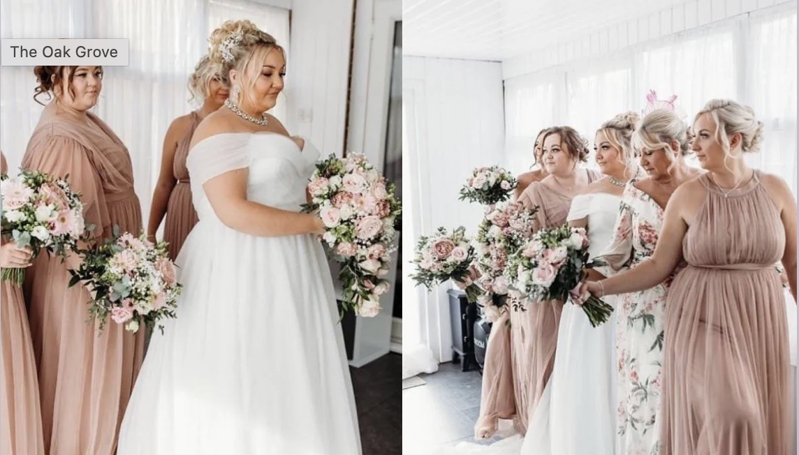 Bride in white wedding dress holding a bouquet, surrounded by bridesmaids in blush pink dresses with bouquets, in a bright indoor setting.