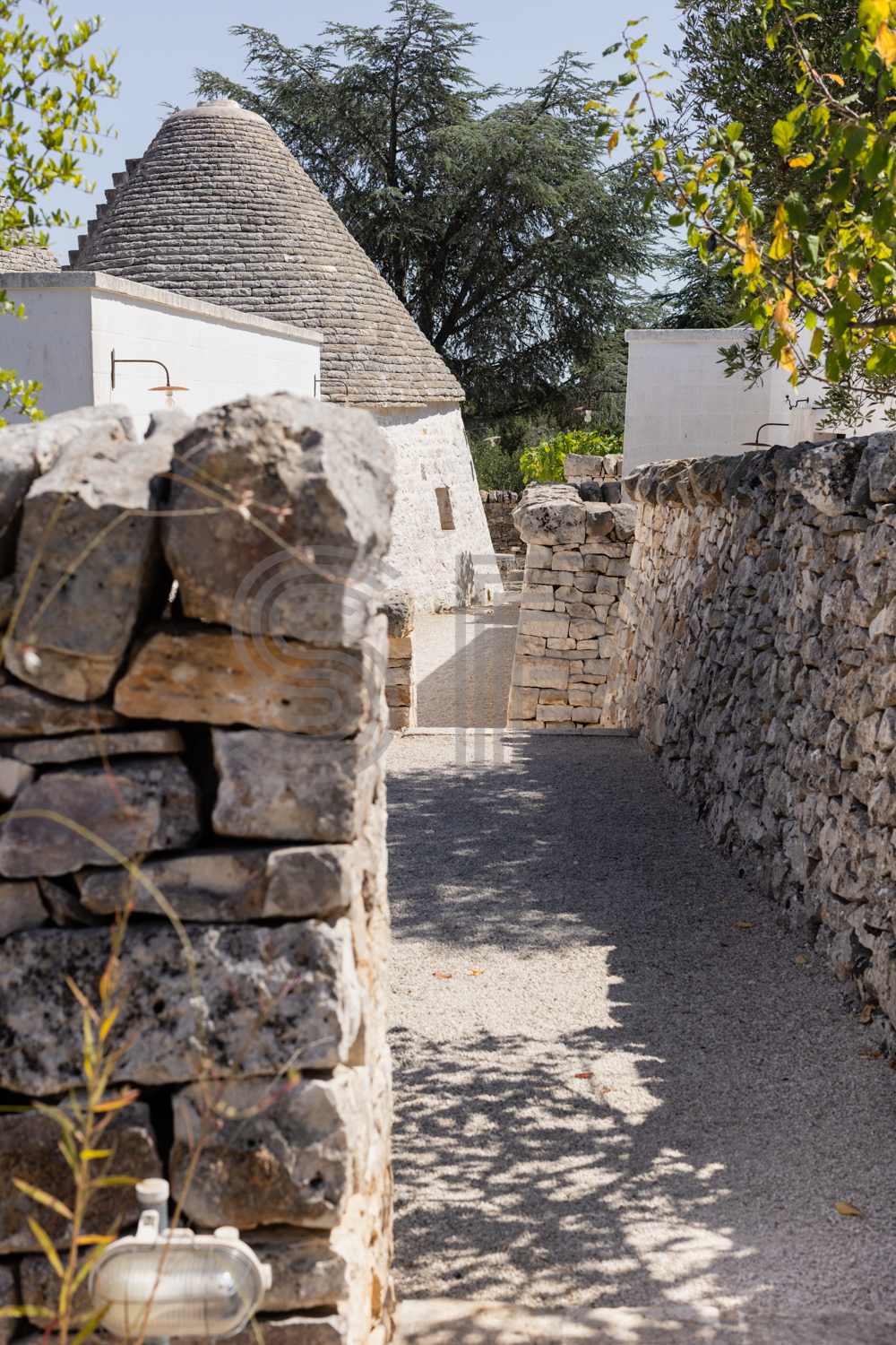 Authentic Pugliese Trullo with conical stone roof, dry-stone walls and rustic courtyard setting