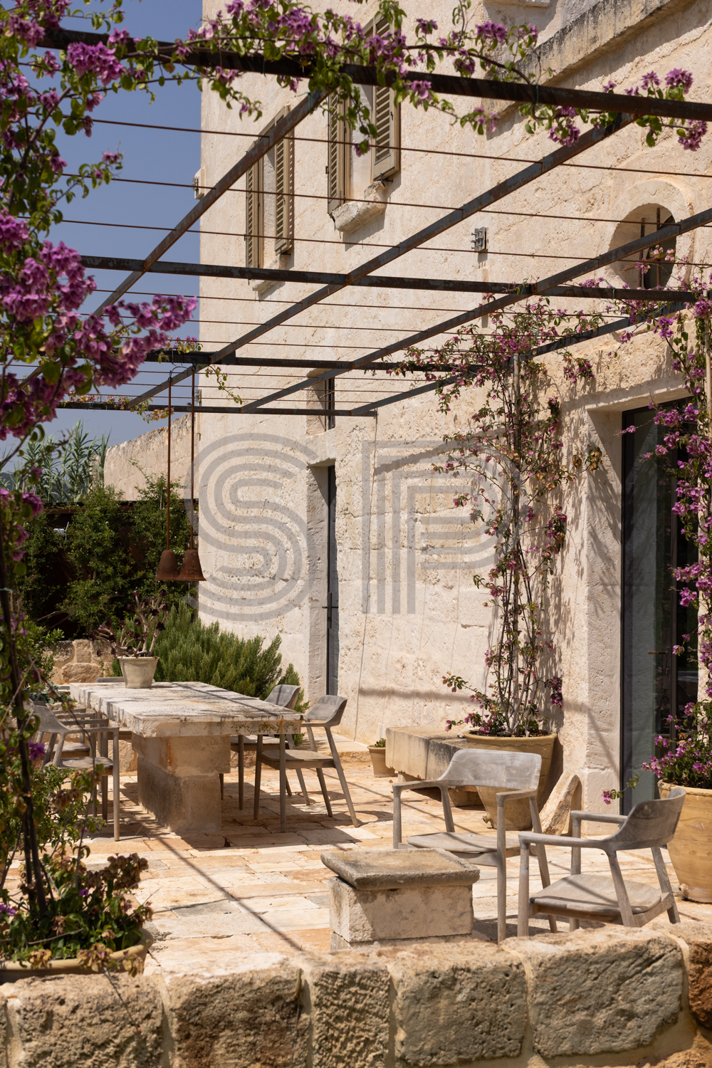 Historic Puglia Masseria shoot location with limestone facade, stone terrace and pergola