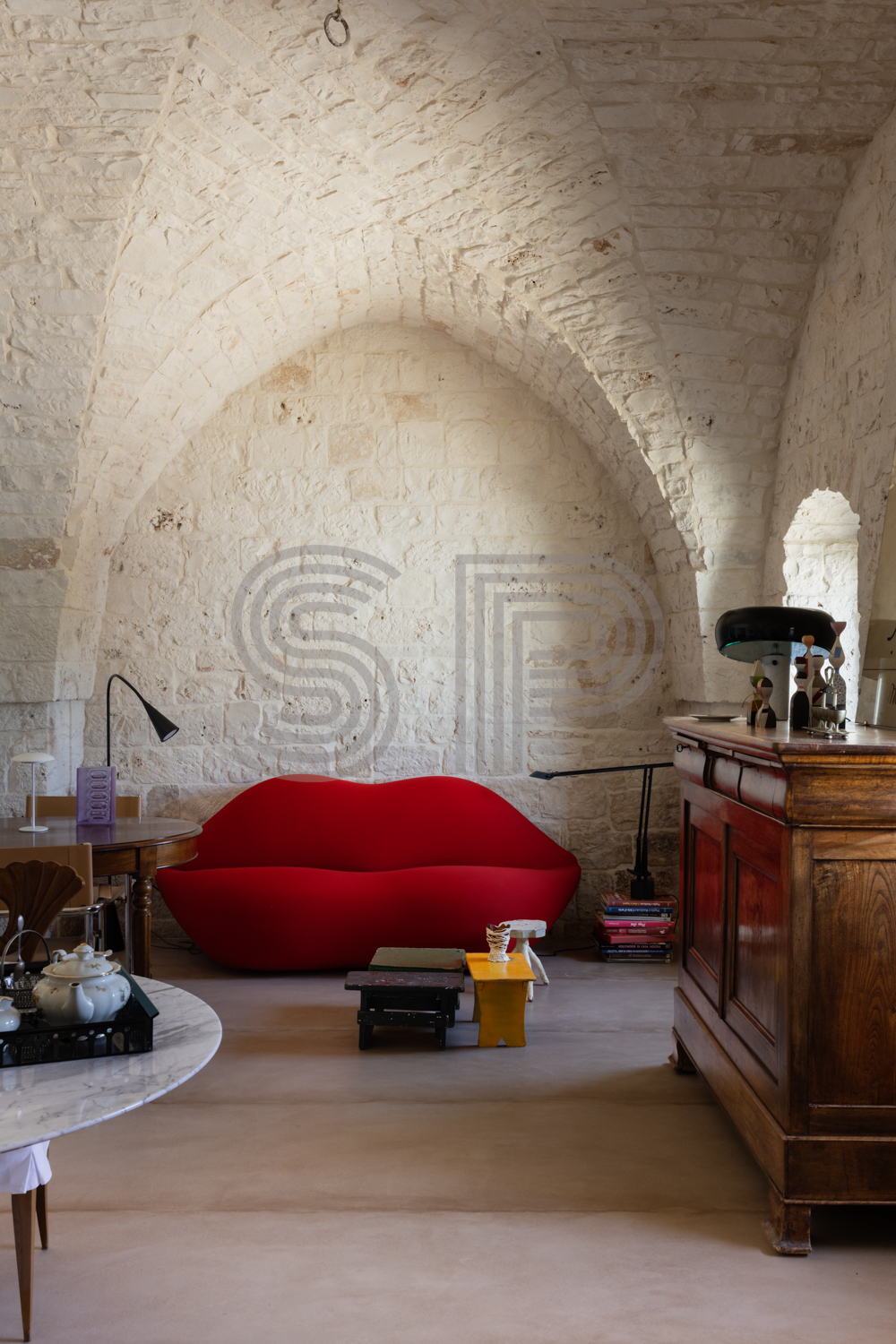 Characterful Trullo interior with exposed Pugliese stone, high vaulted ceiling and traditional arched architecture