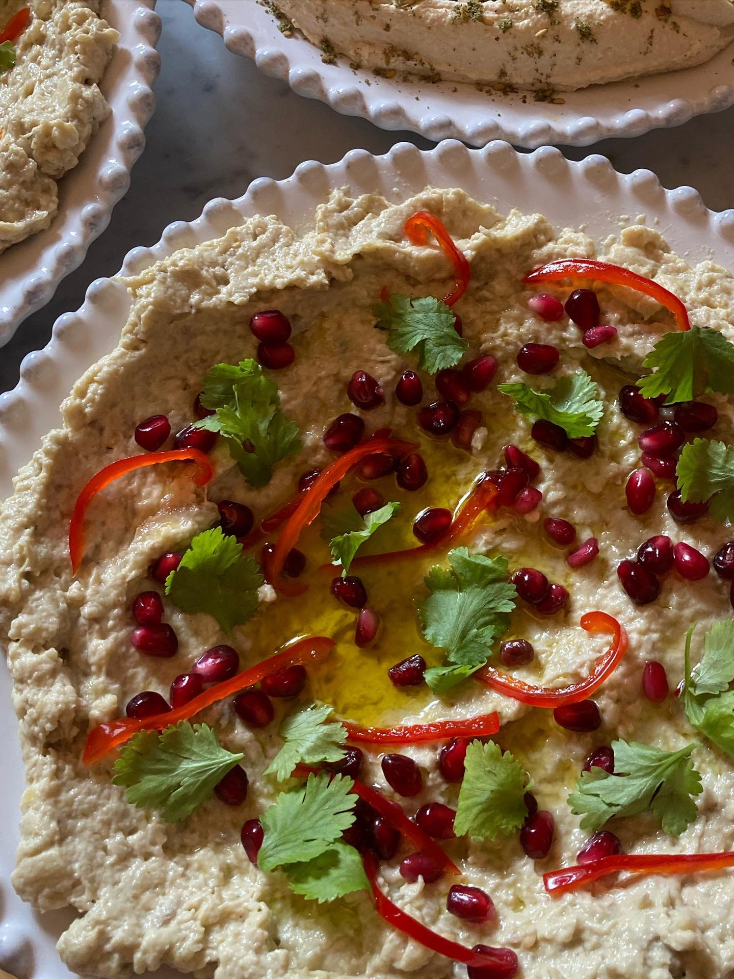 Baba ganoush, candied chilli, pomegranate and coriander (walnuts were on the side because one  guest had a nut allergy).

This was part of a starter for a diner party recently.

Get in touch at hello@joshcooks.co.uk if you would like to chat about an