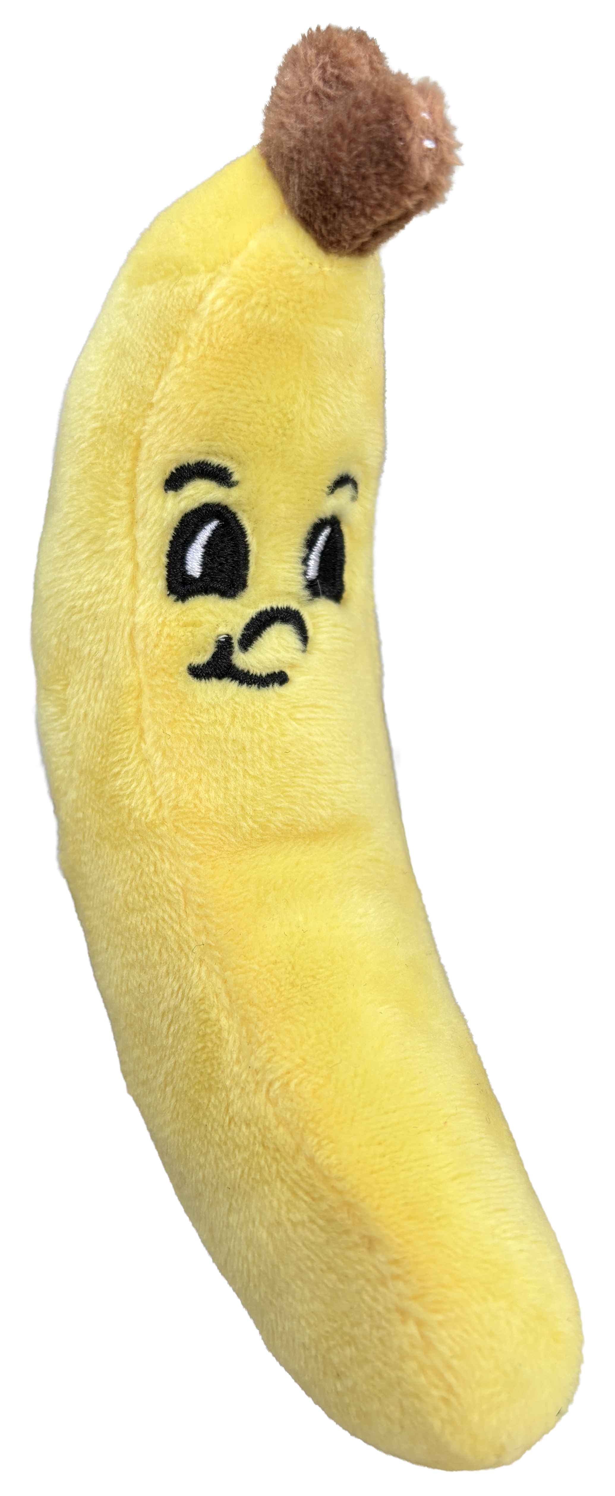 A plush banana toy with a cartoon face, large eyes, and a small smiling mouth, with a brown plush 'top' resembling a banana stem.