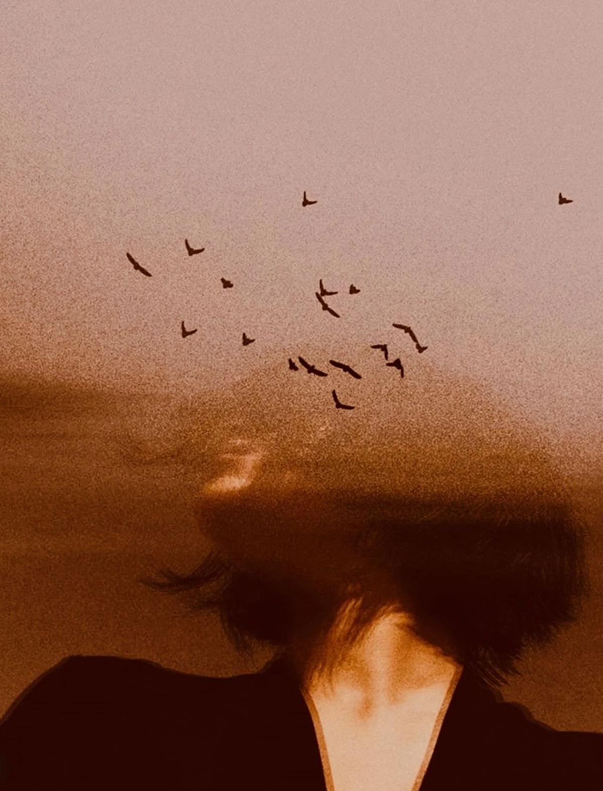 A woman who sees a reality deeper than the one that meets the eye. She is connecting to nature with her senses and their for her intuition as she tunes into presence
