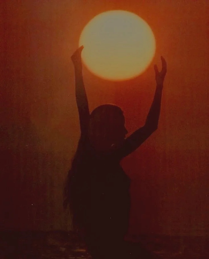 A woman holding the sun, which the sun in tarot represents enlightenment, clarity, and happiness. This photo is a representation of the state of which I intent to help others reach so that they can feel excited and uplifted about their life.