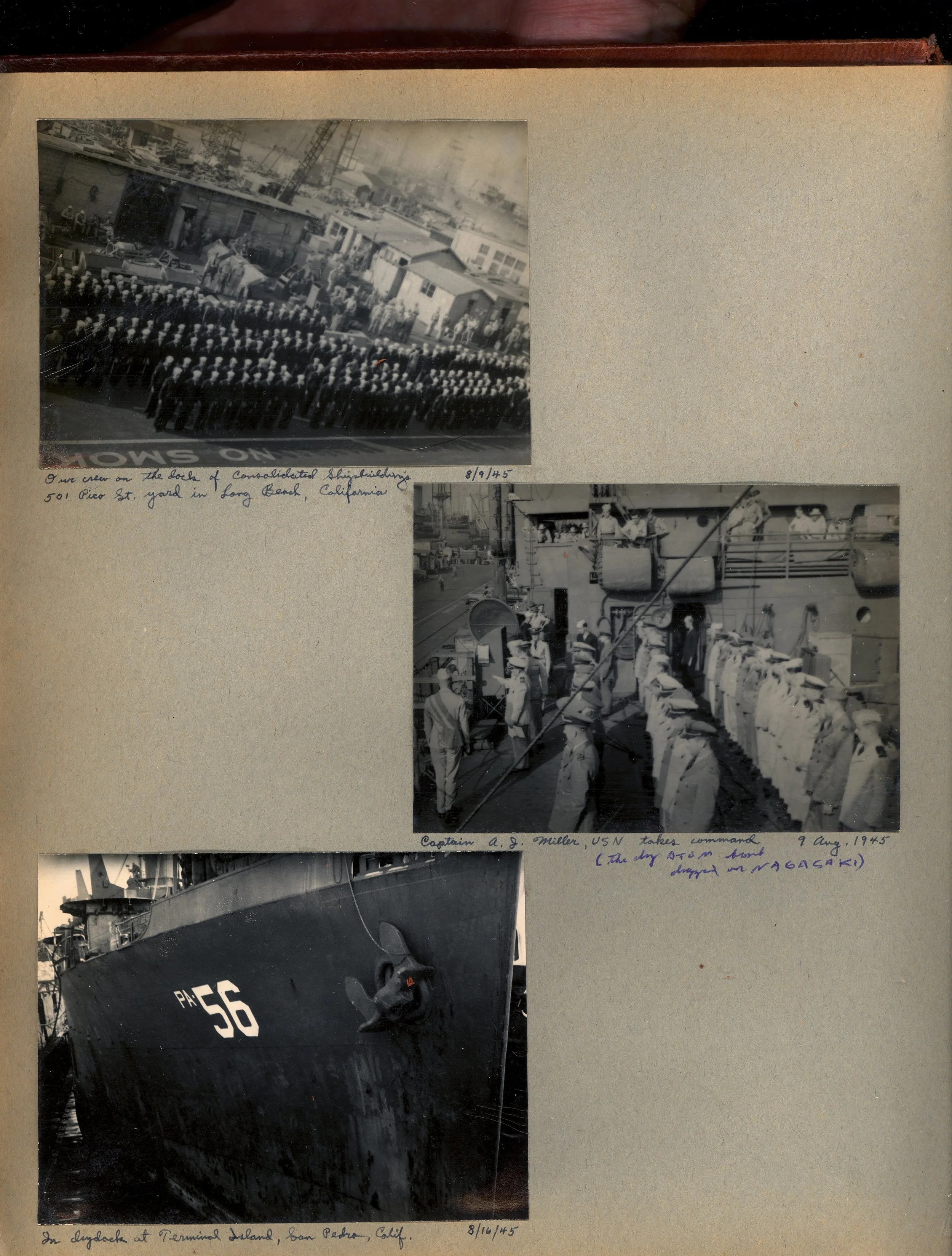 A scrapbook page with three black-and-white photographs from August 1945. The top photo shows a large group of naval personnel standing in formation on a beach in Long Beach, California. The middle photo depicts Captain A. J. Miller of the US Navy taking command aboard a ship. The bottom photo shows the bow of a ship docked at Terminal Island in San Pedro, California.