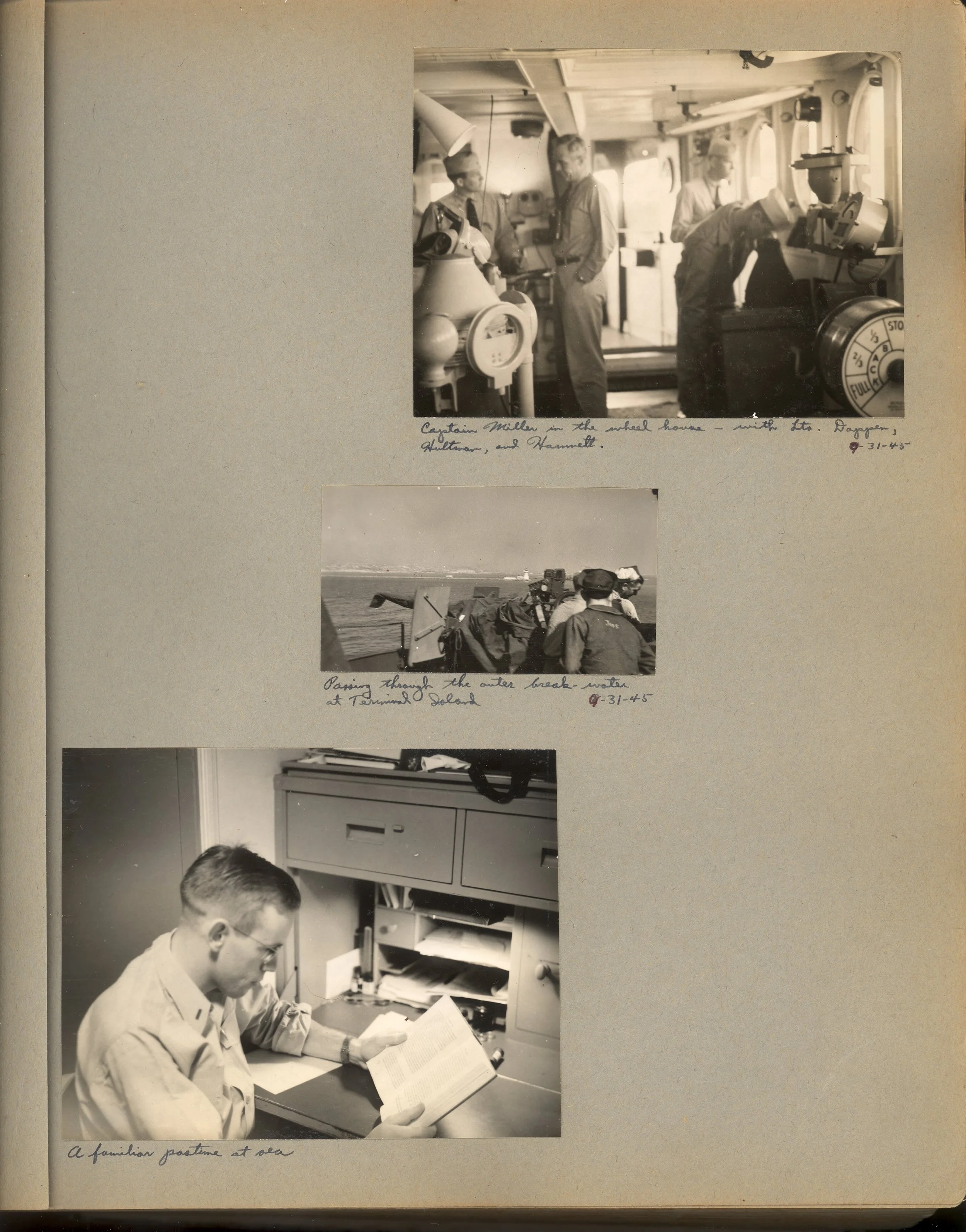 Three black-and-white photographs on a scrapbook page. The top photo shows Captain Miller in a wheelchair with others, labeled 'Captain Miller on the wheel house with Lt. Baggeon, Gullettan, and Hammett.' The middle photo depicts sailors on a boat near water, labeled 'Passing through the outer break water at Terminal Island.' The bottom photo is of a man reading at a desk with a filing cabinet, labeled 'A familiar pastime at sea.'