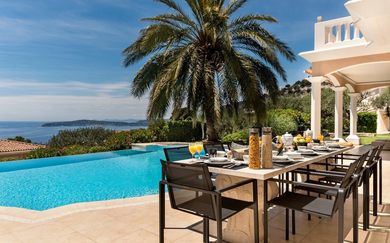 Poolside breakfast at Villa Monaco with panoramic views over the Mediterranean Sea — the morning before a round at the Monte-Carlo Golf Club