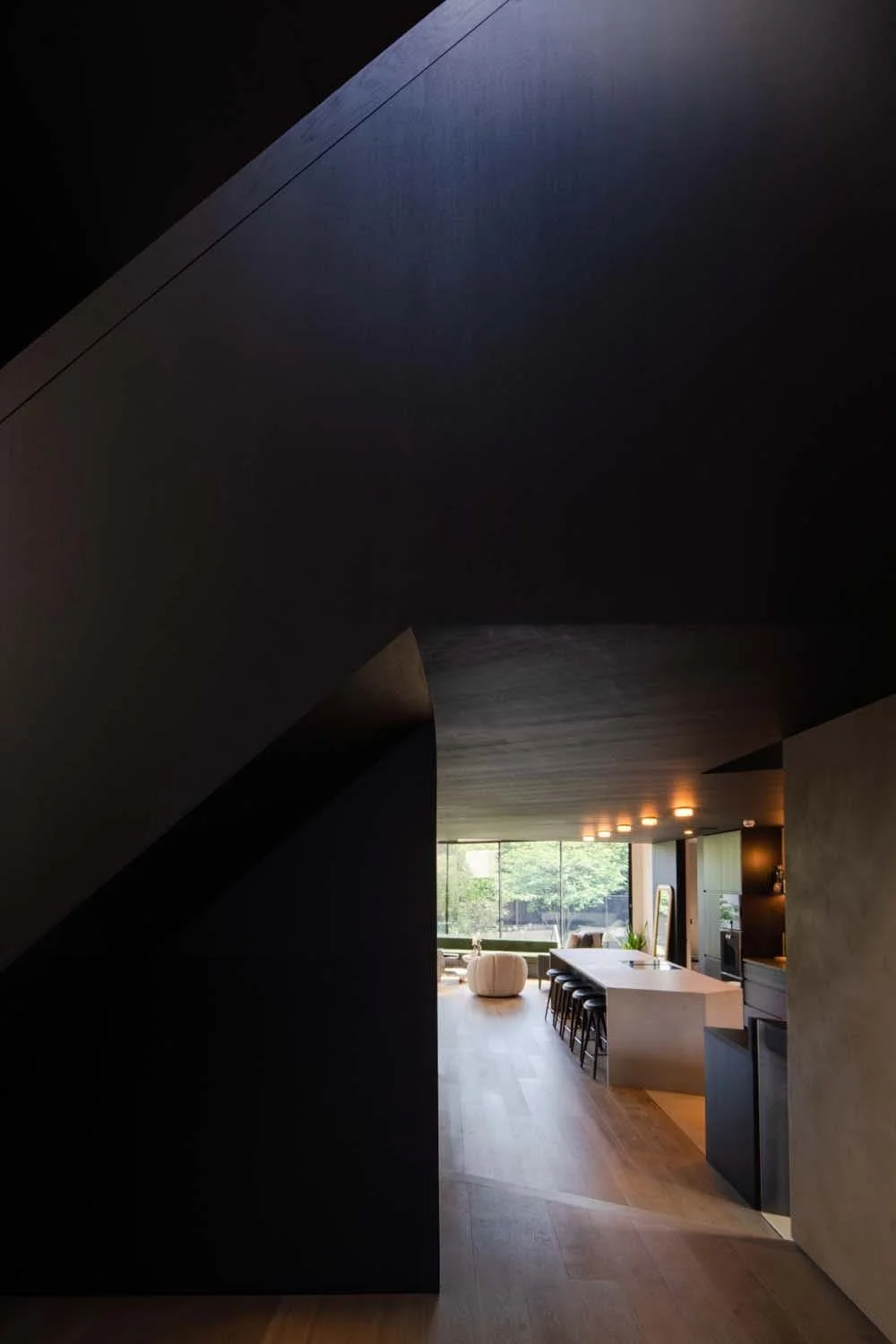 Stunning hallway view leading to an open-plan living area, blending elegance and modern architecture in a London residential space