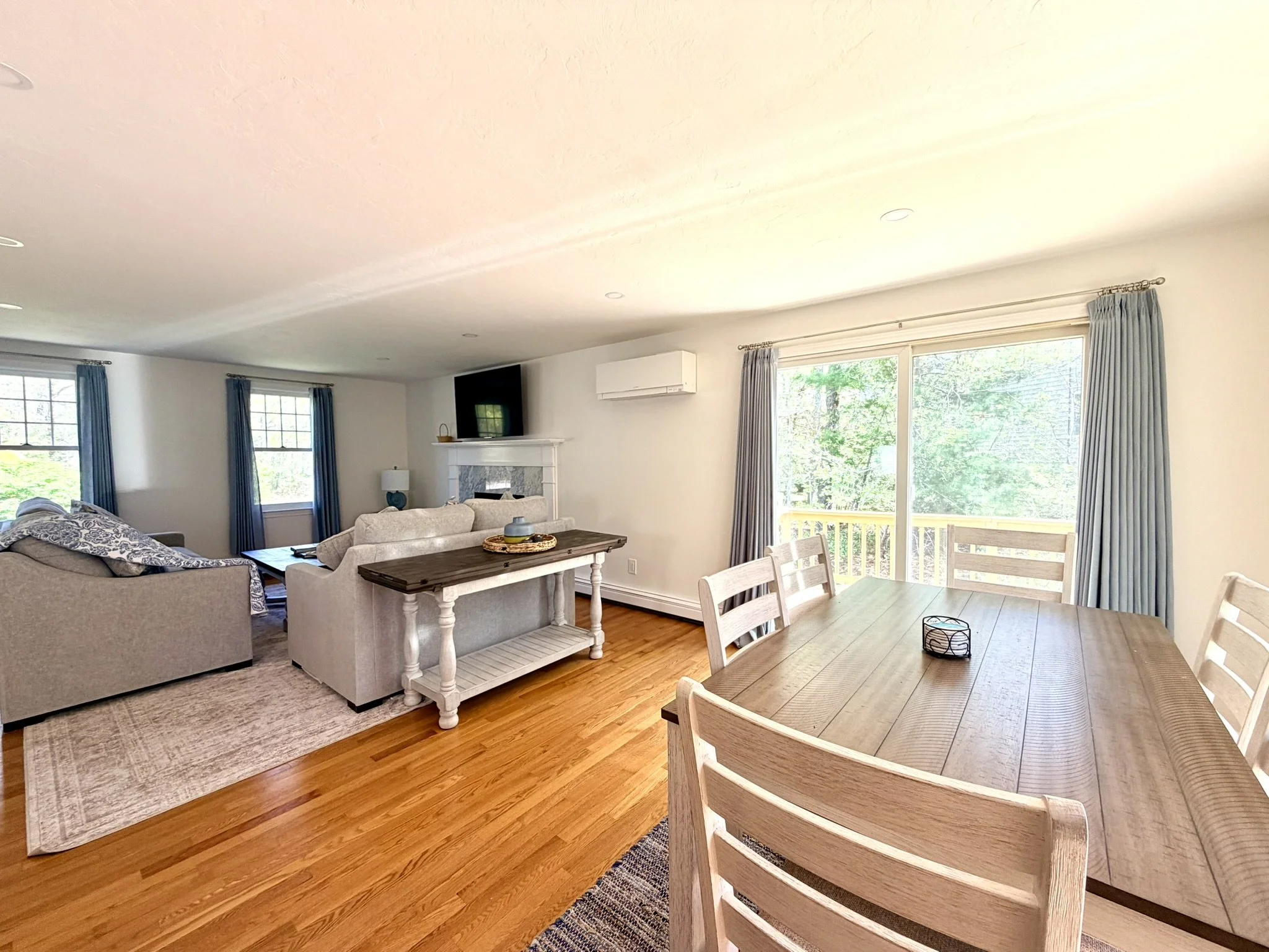 Cape Cod Vacation Rental Management | Tuxfin Hospitality Property - Dog-Friendly Falmouth Home for Short Term Bookings - Save Money over Airbnb & VRBO - Homeowners Rent Second Homes for Extra Income. Living Room Dining Room