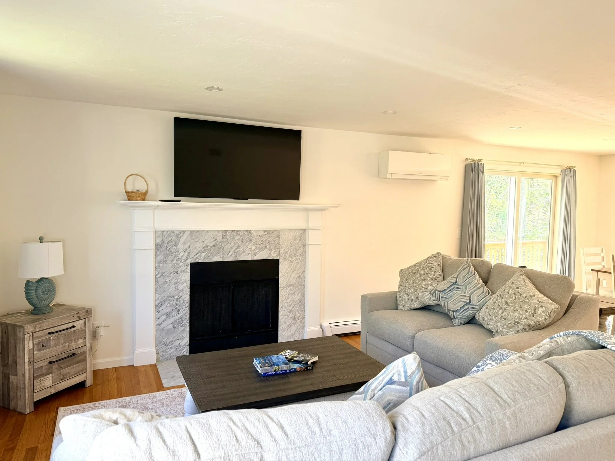 Cape Cod Vacation Rental Management | Tuxfin Hospitality Property - Dog-Friendly Falmouth Home for Short Term Bookings - Save Money over Airbnb & VRBO - Homeowners Rent Second Homes for Extra Income. Living Room. Fireplace TV