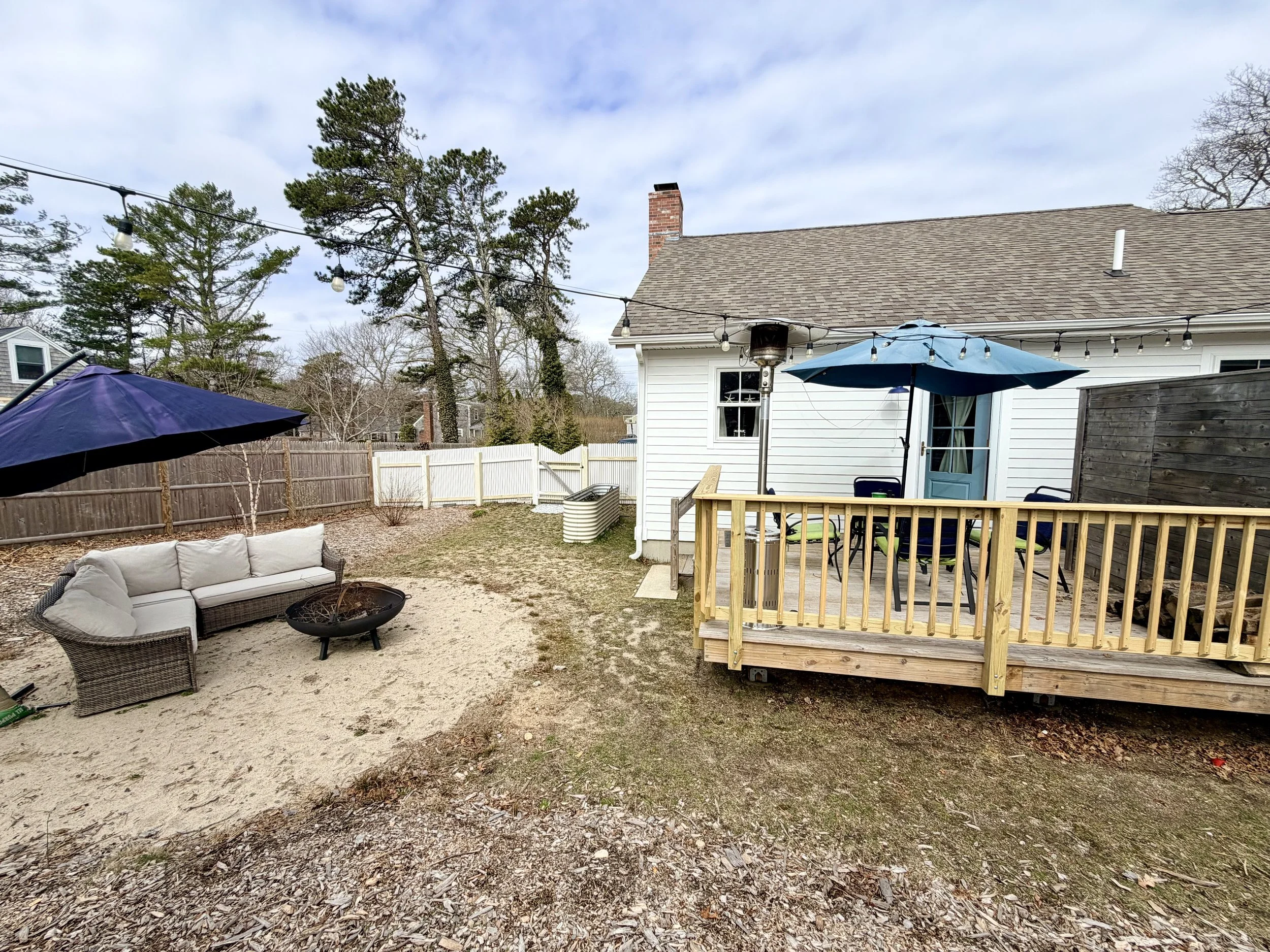 Cape Cod Vacation Rental Management | Tuxfin Hospitality Property - Harwich Dog Friendly Home - Outdoor Fire Pit, Deck, Seating