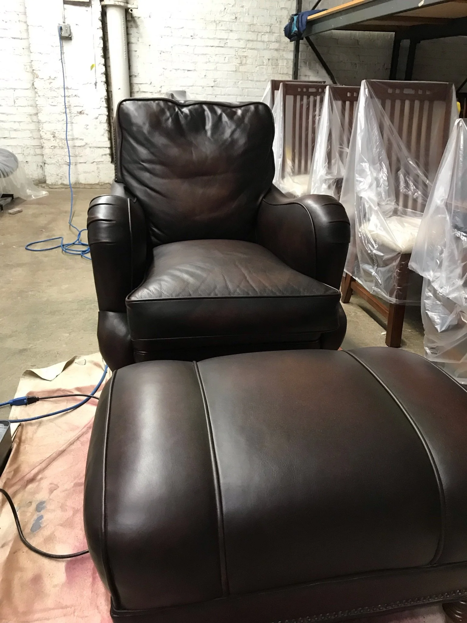 Chair and Ottoman brought back to life. Leather chair and leather Ottoman are now re-dyed, sealed, conditioned and ready to use. Work done in Ravenswood, Illinois, Northern Chicago. 