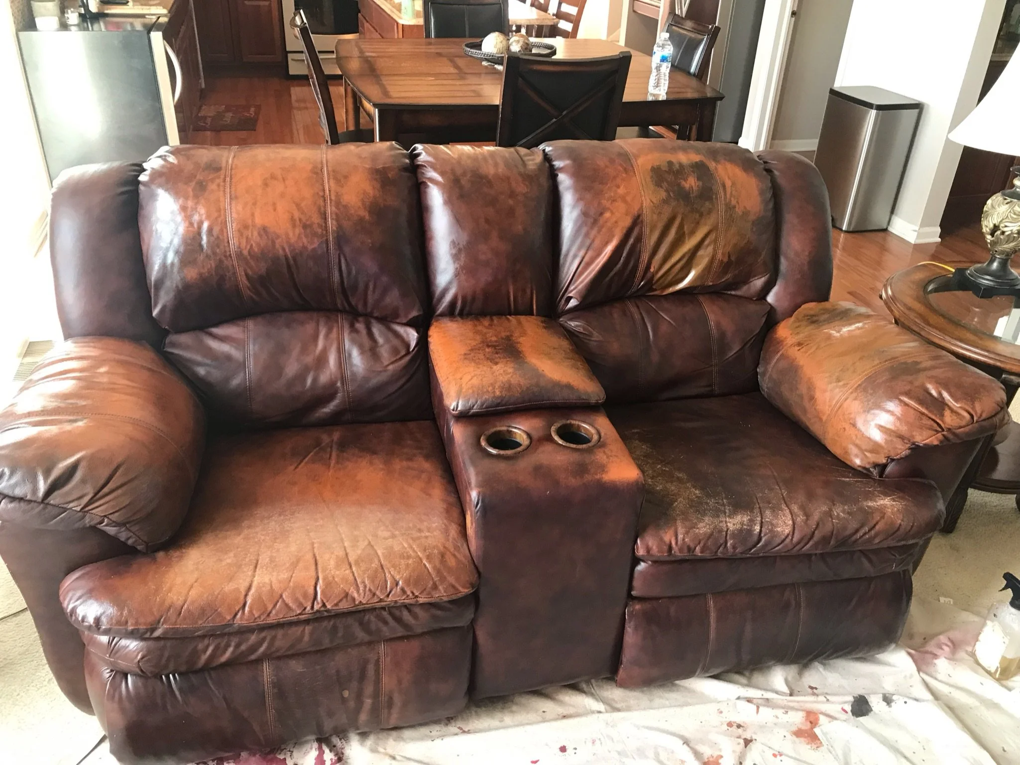 Before photo of loveseat. Color has been stripped off of loveseat sofa. Work performed on-site in Elburn, Illinois