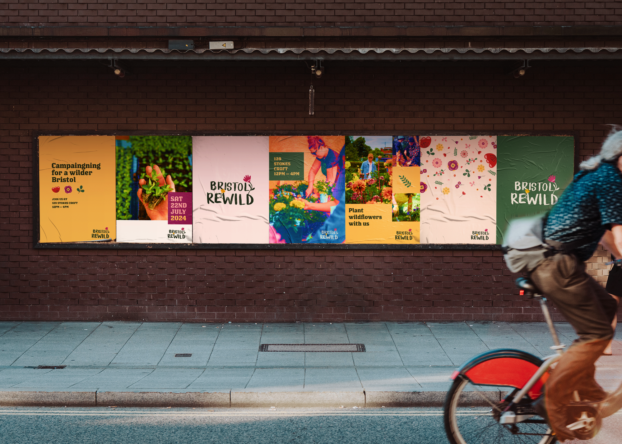 Billboard advertising community event for brand Bristol Rewild, with colourful posters featuring activities for planting wildflowers and crafting, mounted on a brick wall with a cyclist passing by.