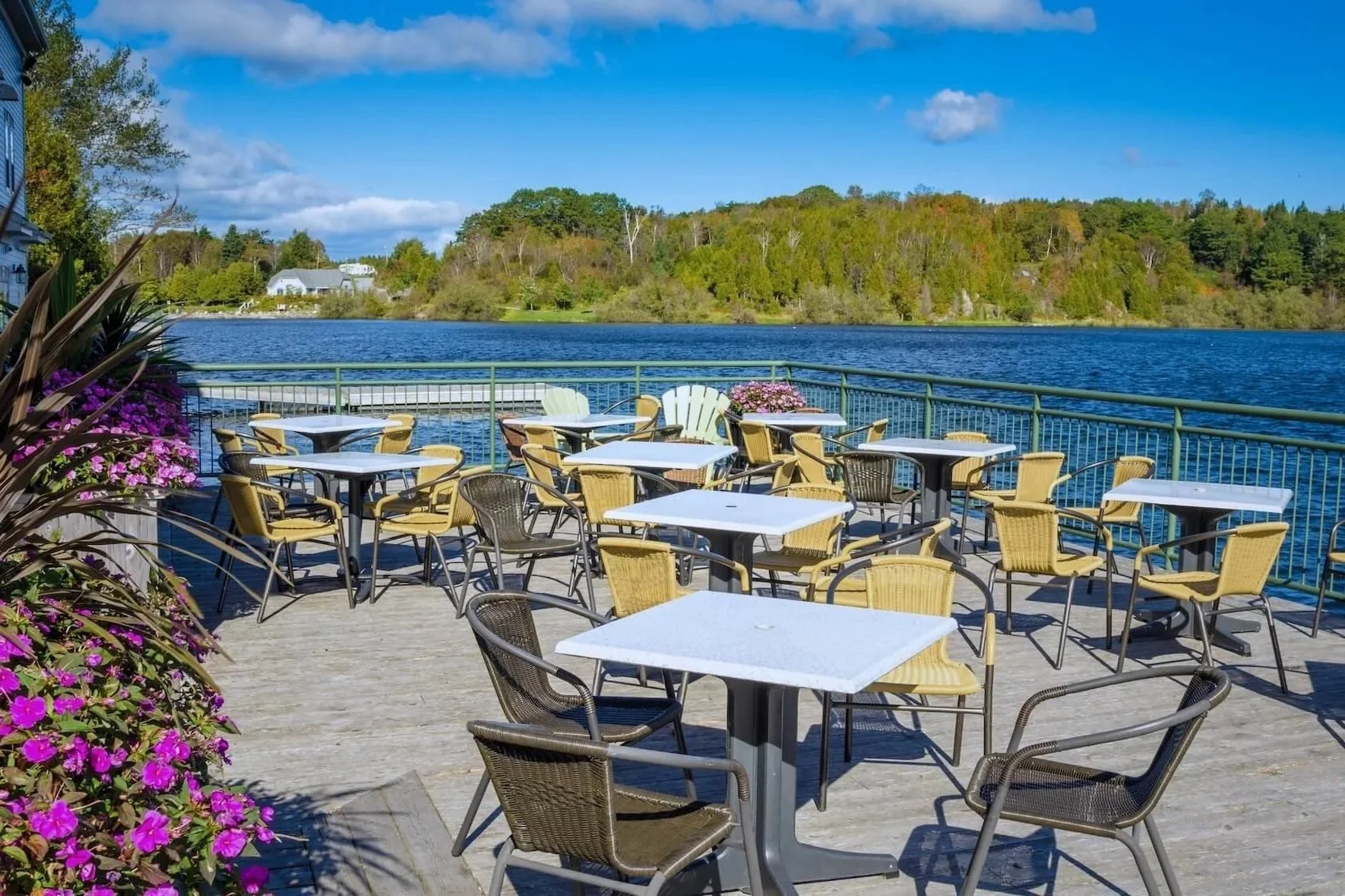 Outdoor patio restaurant seating setup next to a lake in Sutton, MA.