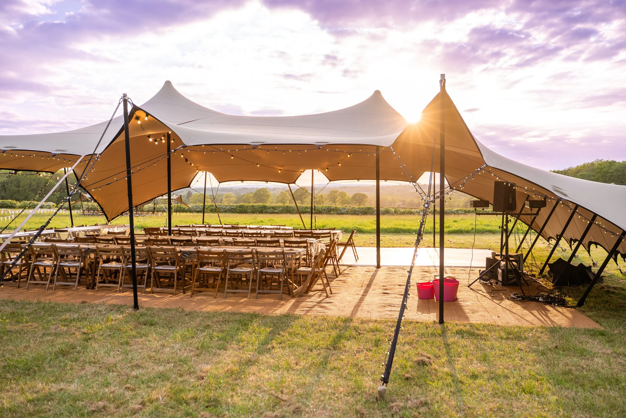 Marquee with seats set up in the sunshine