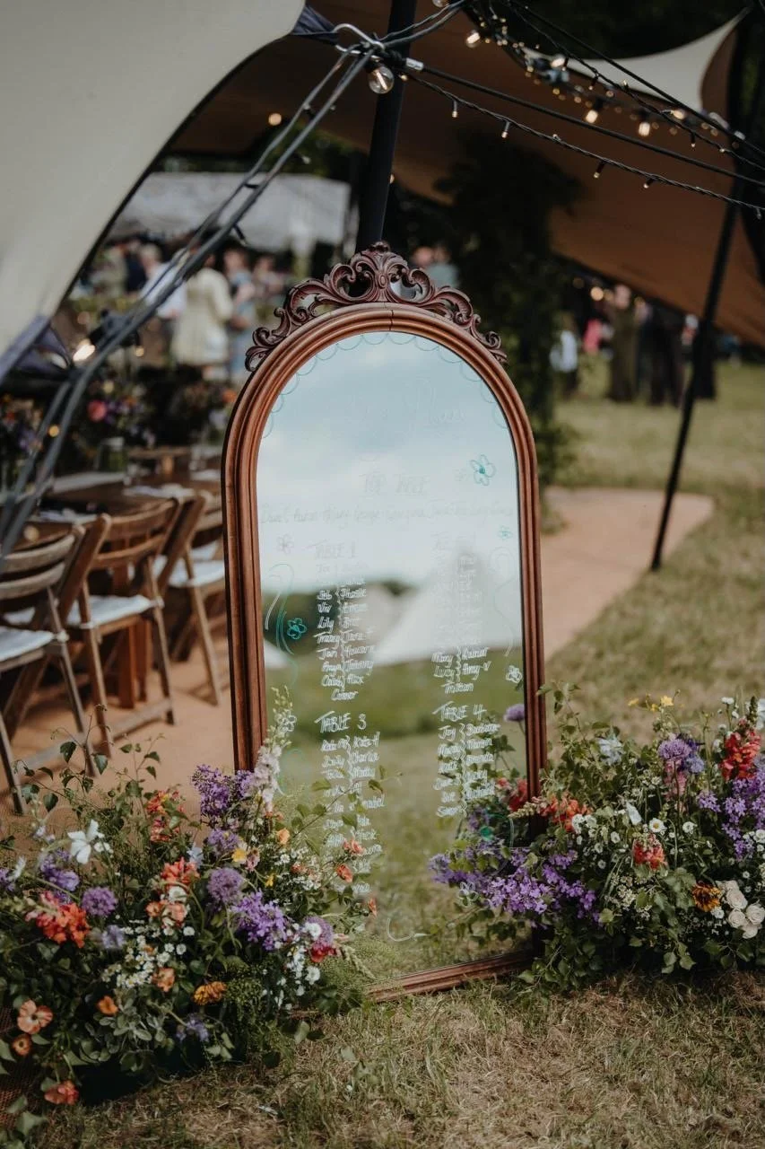 place names on a beautiful mirror for a wedding meal