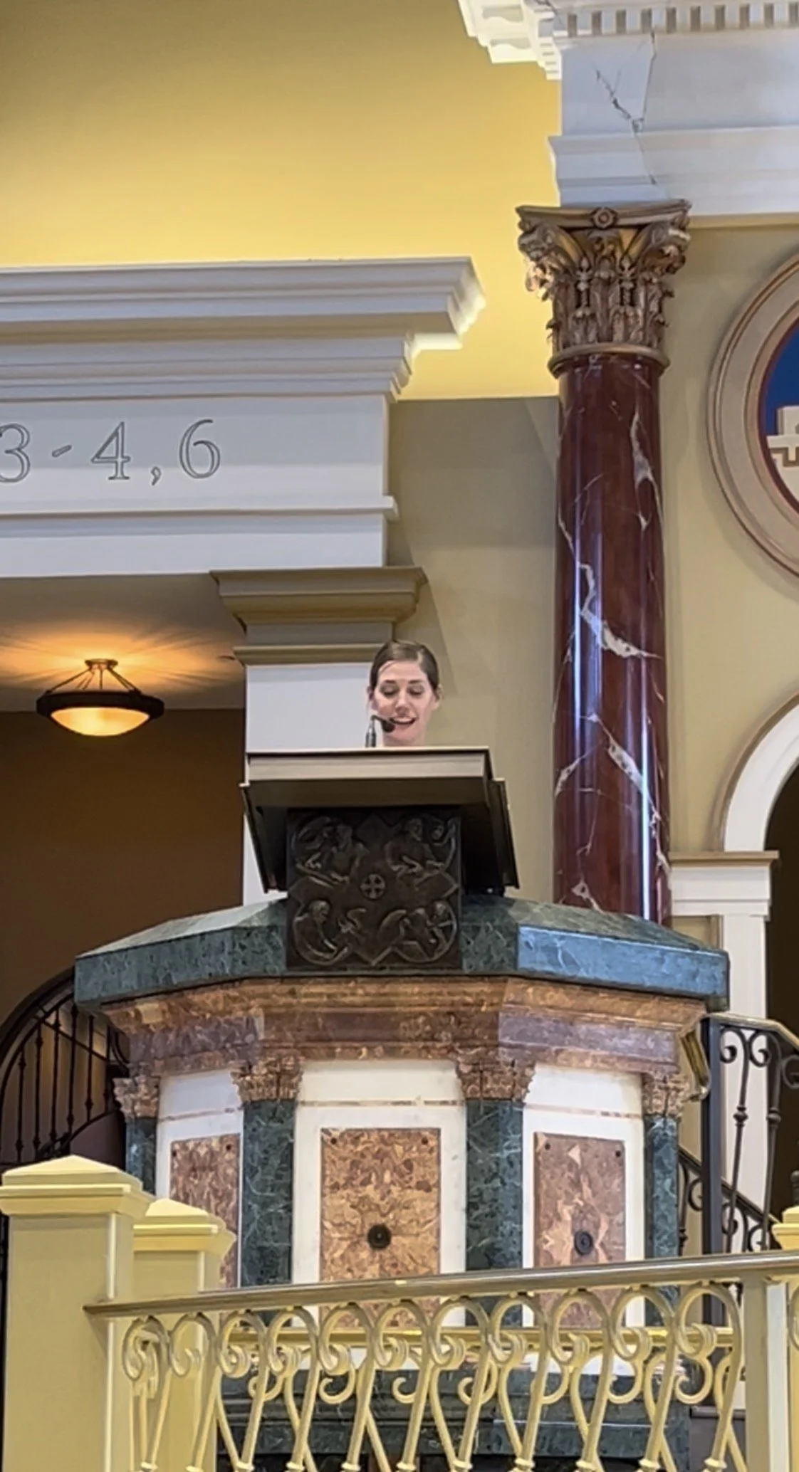 Ashley Heyburn speaking at a conference about faith, caregiving, and hope.