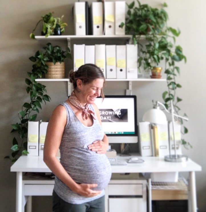 Ashley Heyburn during her pregnancy with her son while writing about motherhood and unexpected journeys.