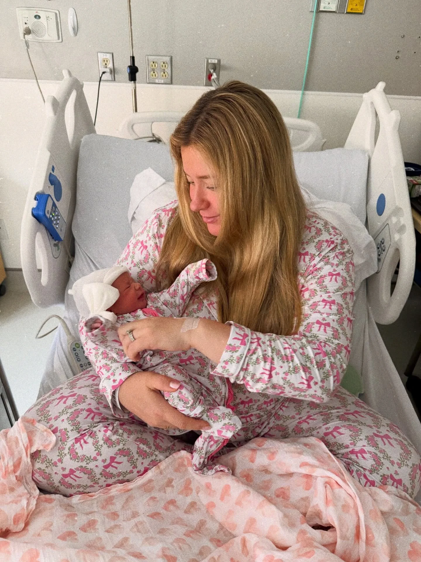 Just hours after meeting our first daughter for the first time. This photo was taken in a hospital bed, in the quiet moments after your arrival. Exhausted, emotional, and heart completely full, holding our daughter for the first time. I am wearing my