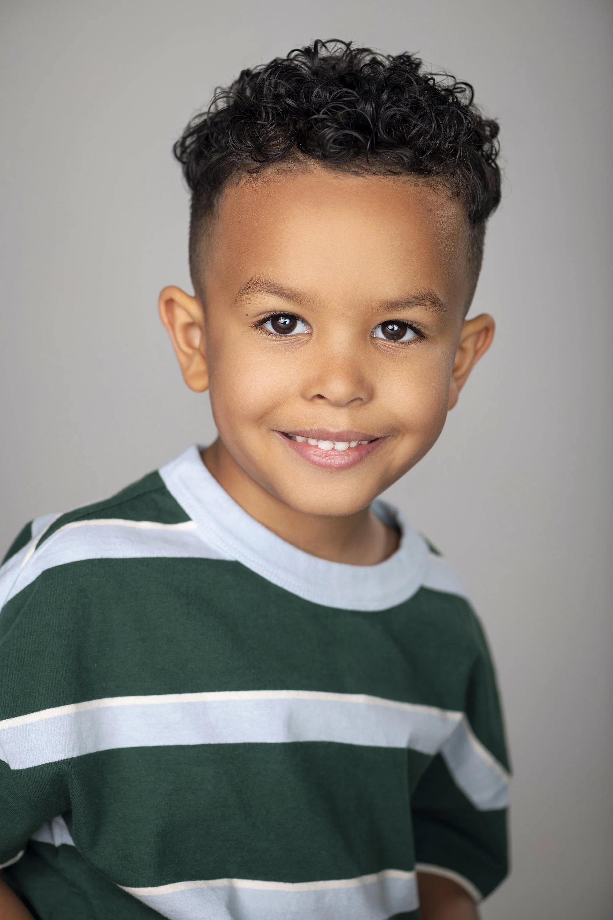 Atlanta GA lifestyle family photography by Caitlin Tabilog featuring Sada Jackson and family, high-end studio portrait session with fashion editorial style, smiling candid family moments for Forward The Agency