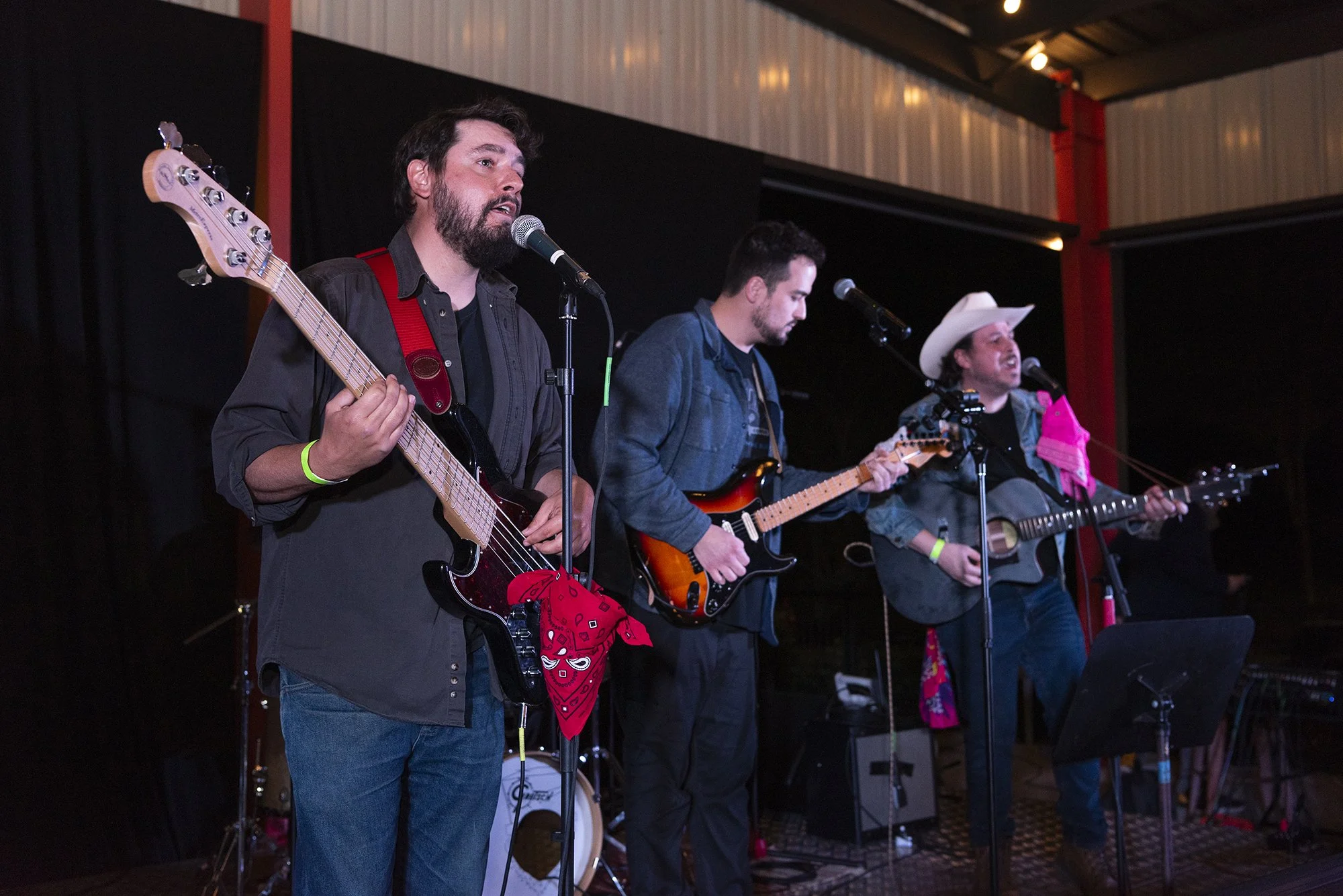 Candid event photography Atlanta by Caitlin Tabilog at Reformation Brewery Woodstock Georgia, live band performance with authentic crowd energy, musicians playing guitar drums and vocals