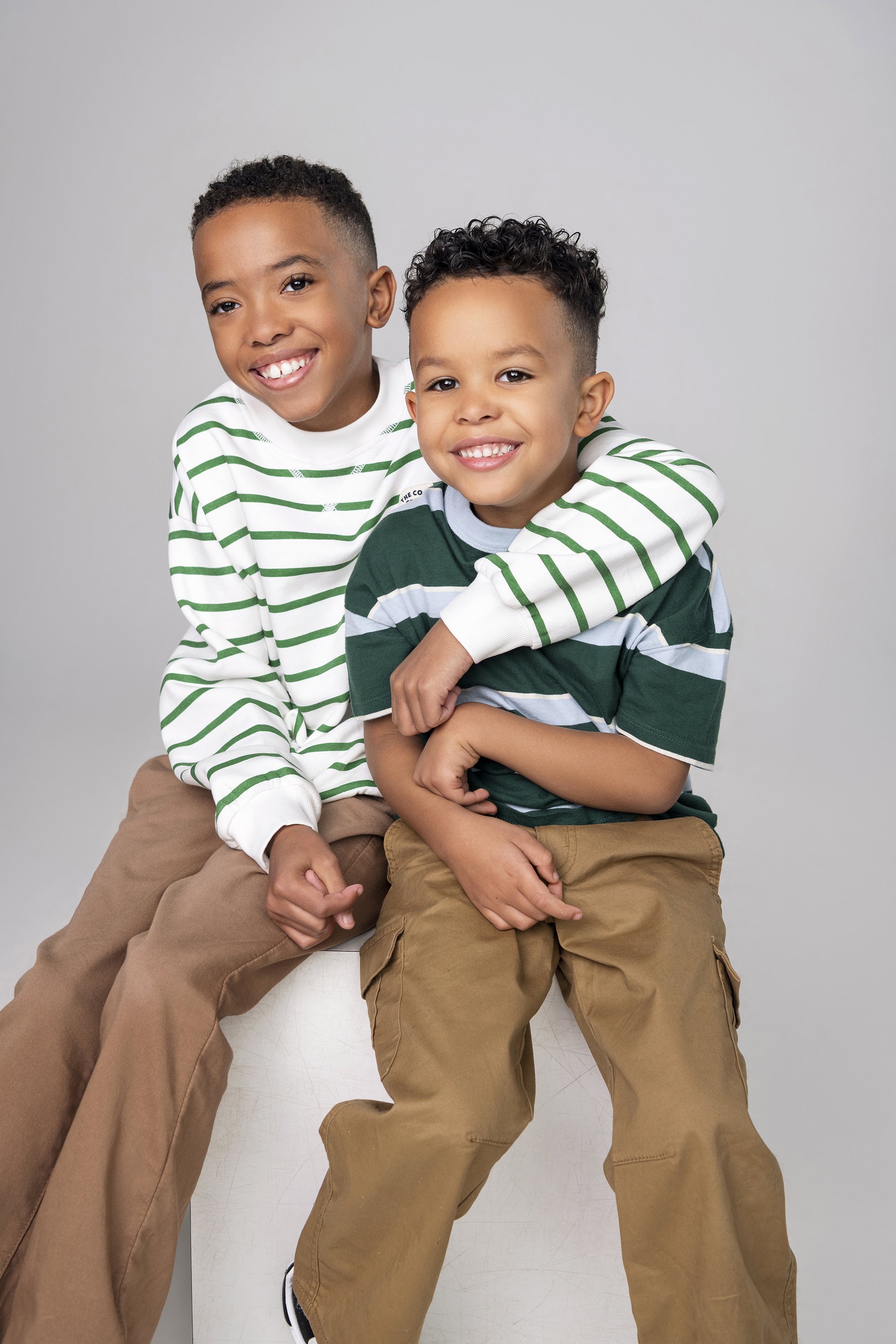 Professional Atlanta family portrait photographer Caitlin Tabilog studio lifestyle photoshoot of Sada Jackson and her family, modern editorial family portraits with natural laughter and connection, Forward The Agency talent