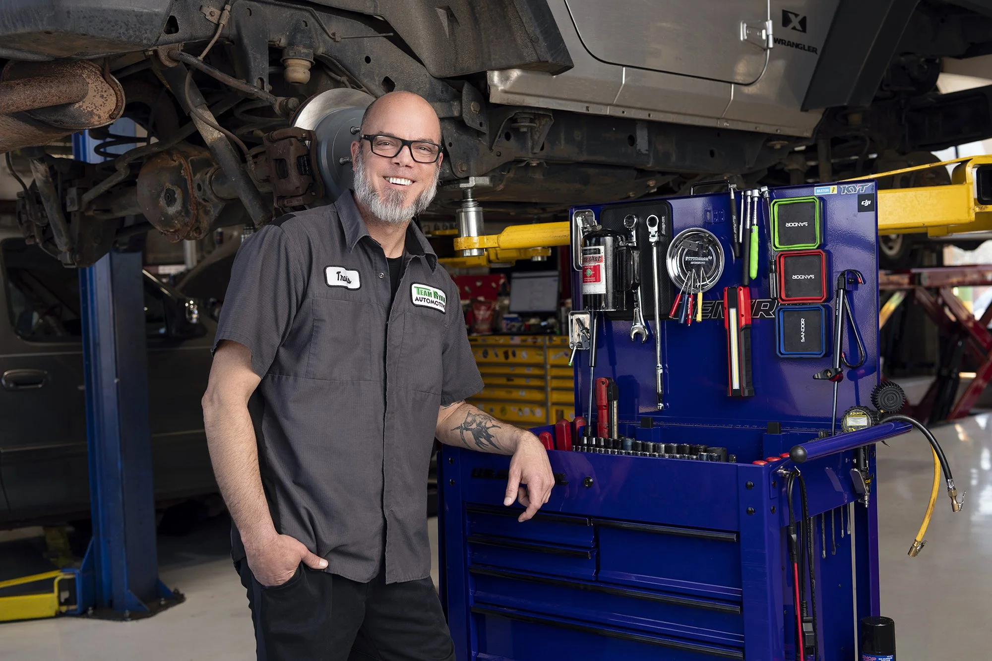 Professional employee headshot portrait photographed on location at Team Ryan Automotive in Cumming, Georgia by Atlanta corporate headshot photographer Caitlin Tabilog.