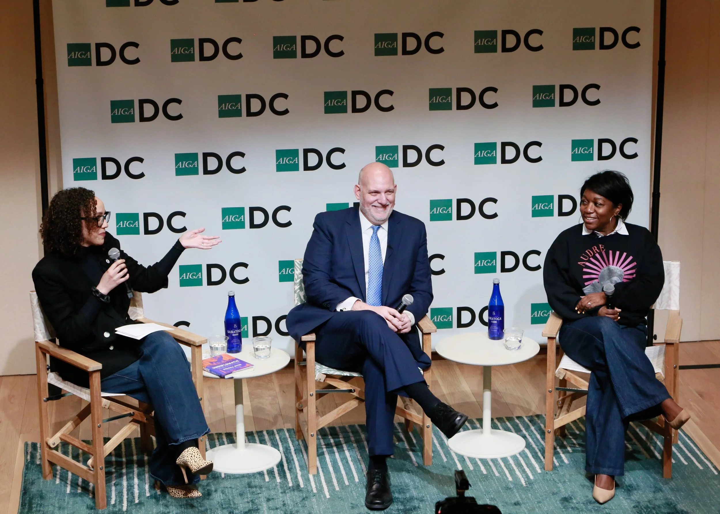 AIGA DC - Designing Democracy's Front Door panel - three panelist speak in front of a live audience.