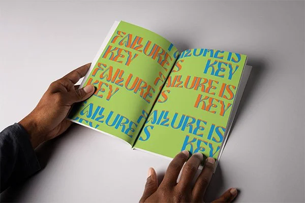 York Mgbejume holding open his "TRIP" Zine
