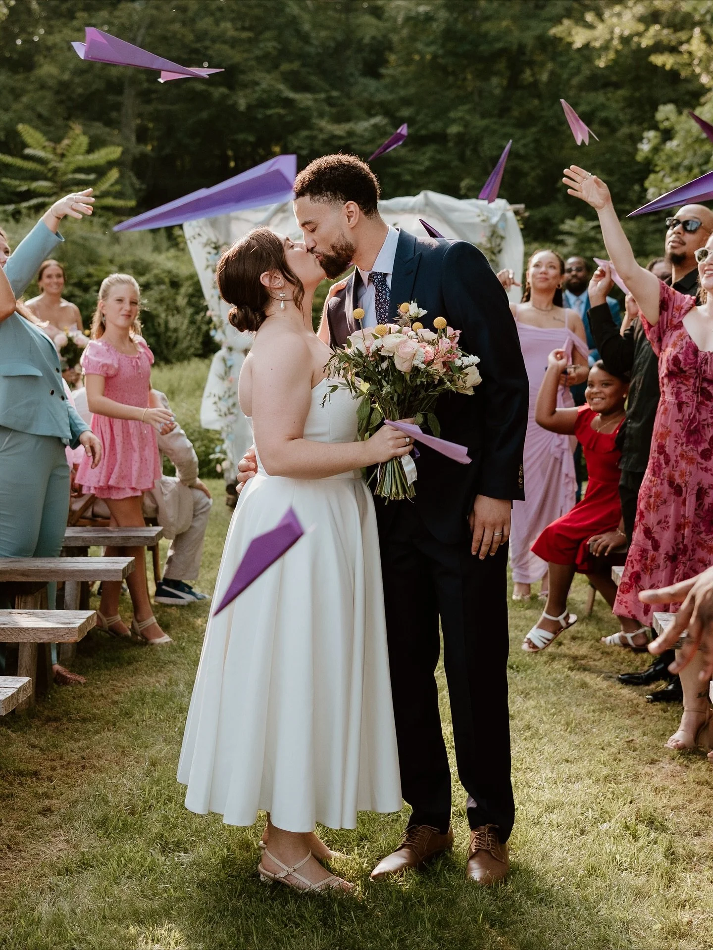 Guests wrote words of love and encouragement for the couple, folded them into paper airplanes, and as the newlyweds shared their first kiss, the planes took flight - surrounding them in love. 

Venue: @stonehillsfarmhouse 
Photographer: @littlecactip