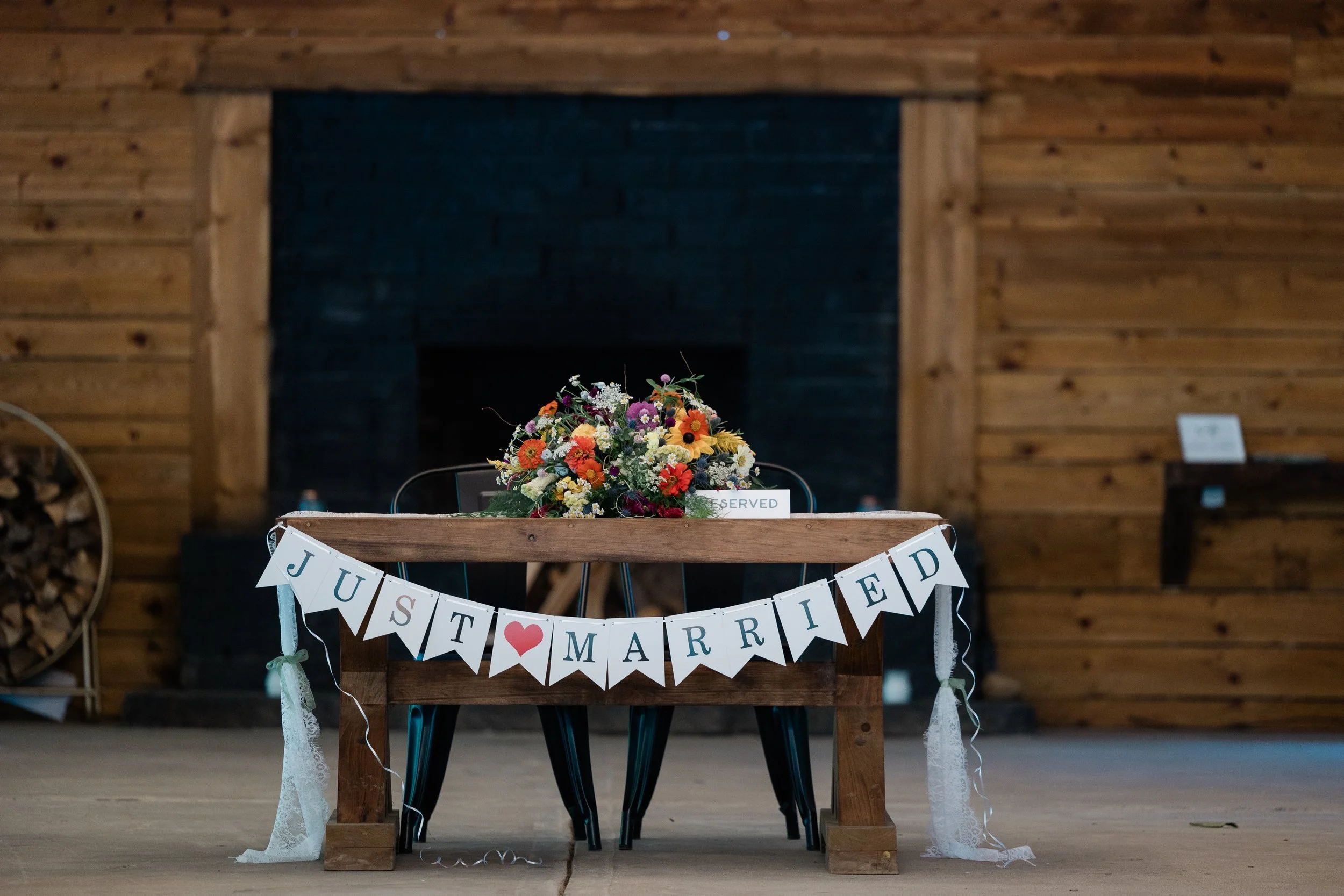 a_sweetheart_table_in_front_of_fireplace.jpg