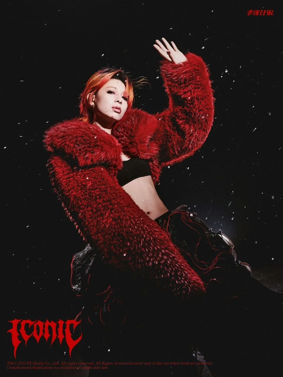 A woman with orange hair poses against a dark background, wearing a red fur coat, a black crop top, and black pants, with snowflakes falling around her.