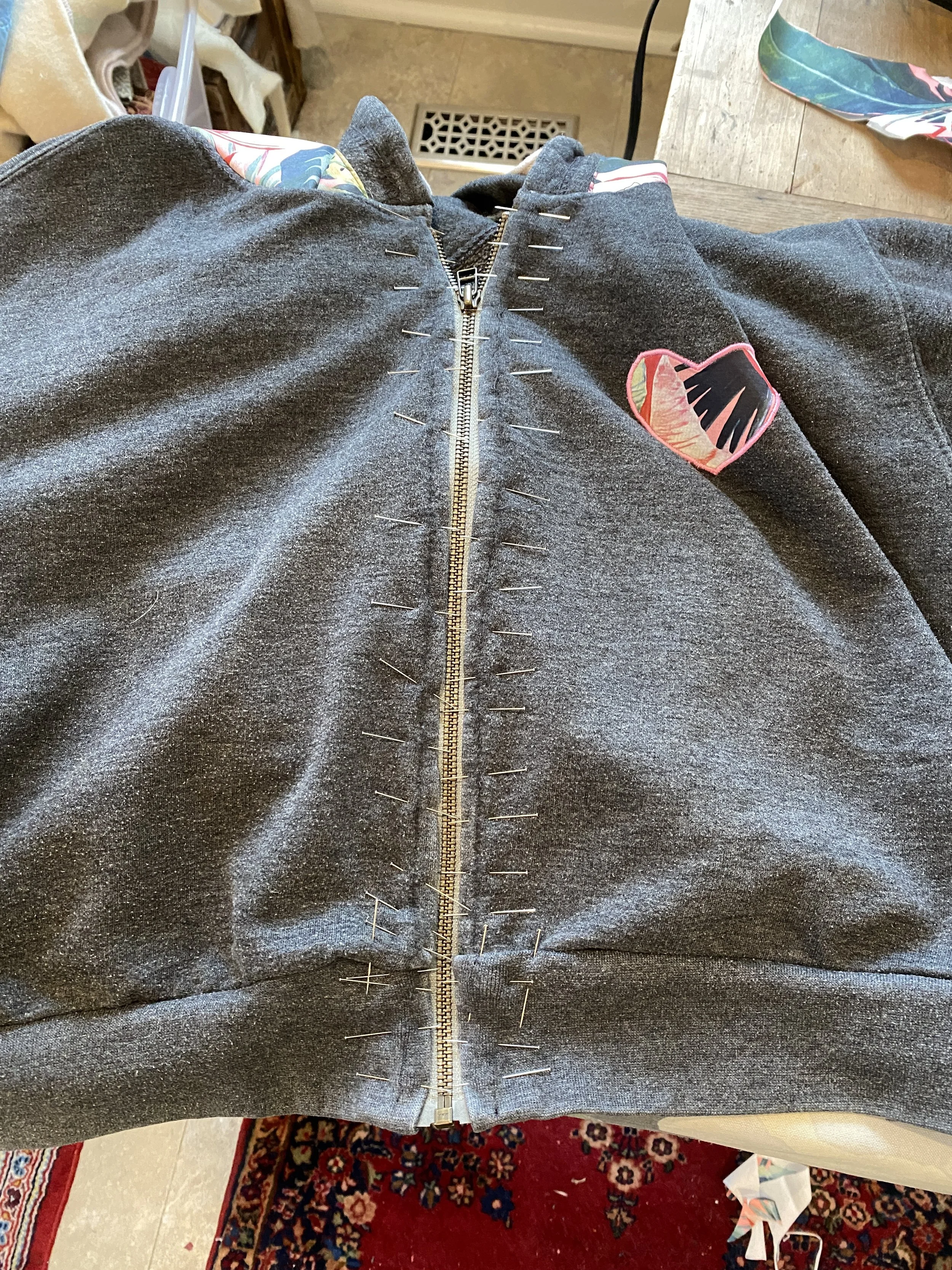 Pin the new zipper (shortened in-house) in place