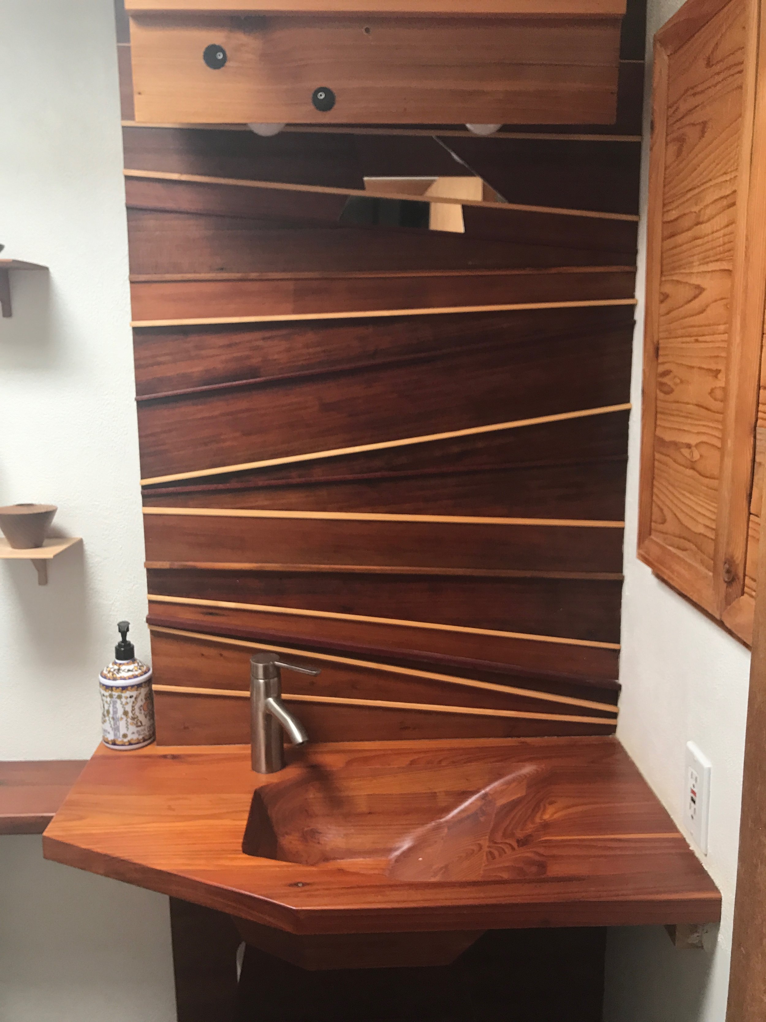 Imagine that, a wood sink! Sink made from redwood, backsplash is redwood with accents of purpleheart, maple, walnut and ebony.