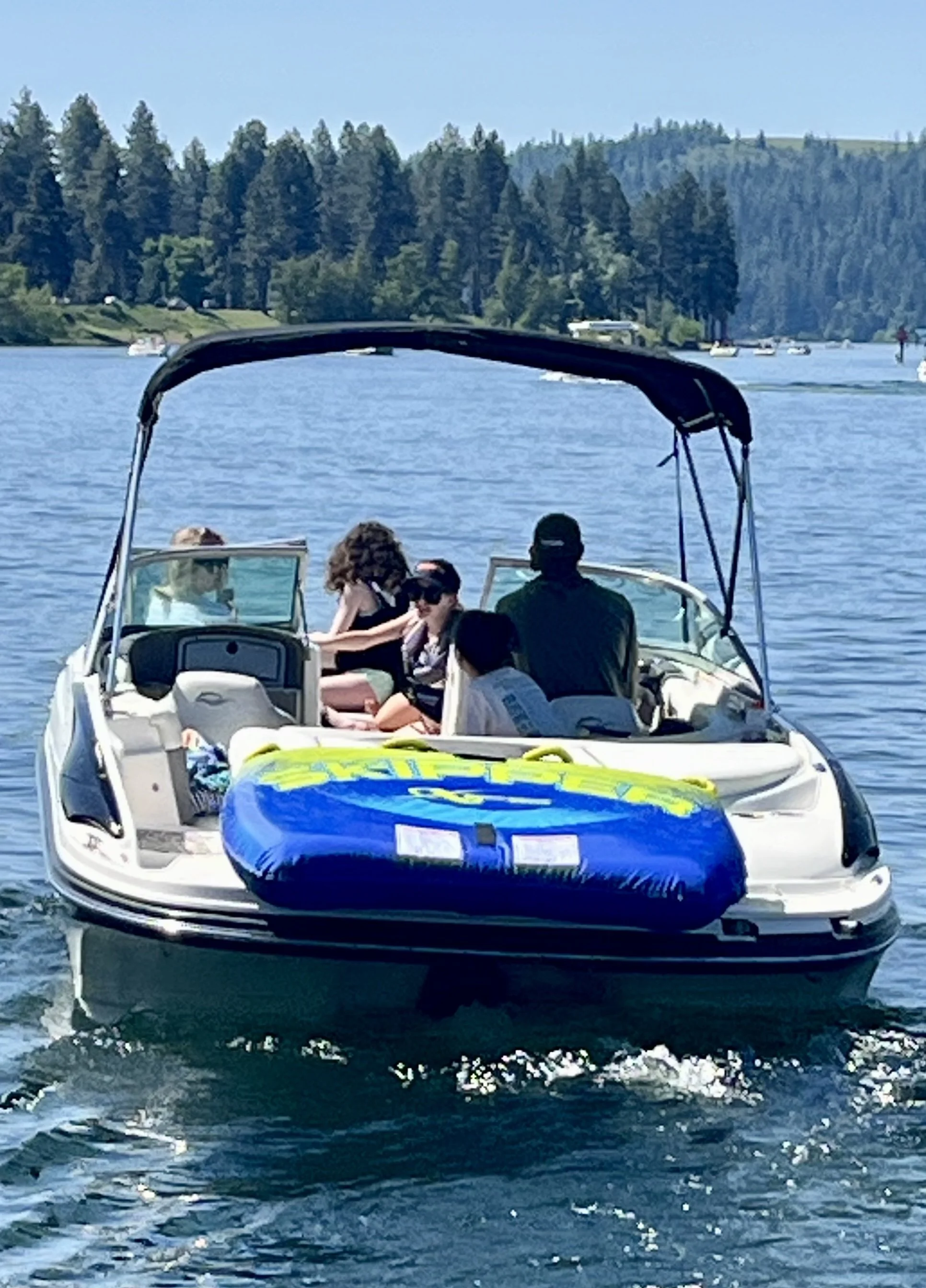 Tubing behind ski boat on Lake CDA