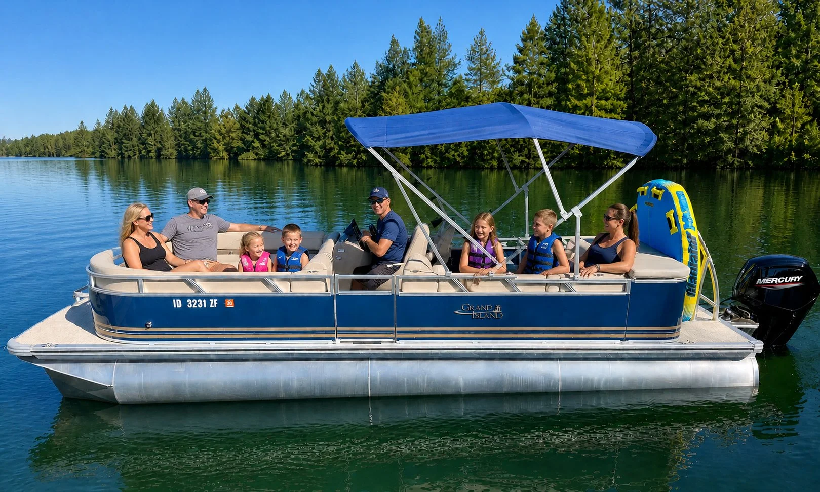 Family on a pontoon boat rental at Lake Coeur d'Alene, Idaho, practicing safe boating-Kent's Boats