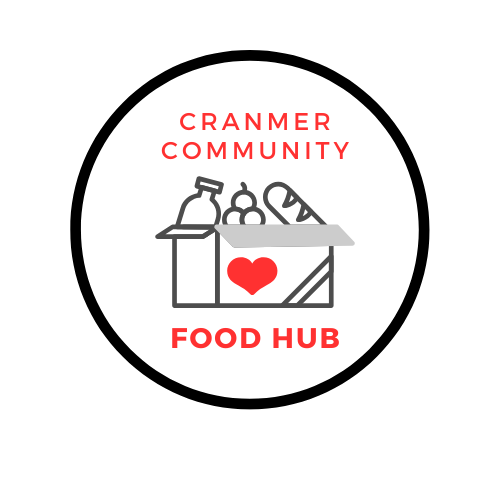 Logo for Cranmer Community Food Hub featuring a black circle outline, a gray grocery box with a red heart on the front, and items like a bottle, fruit, and bread inside. Text above and below the box reads "Cranmer Community" and "Food Hub" in red.