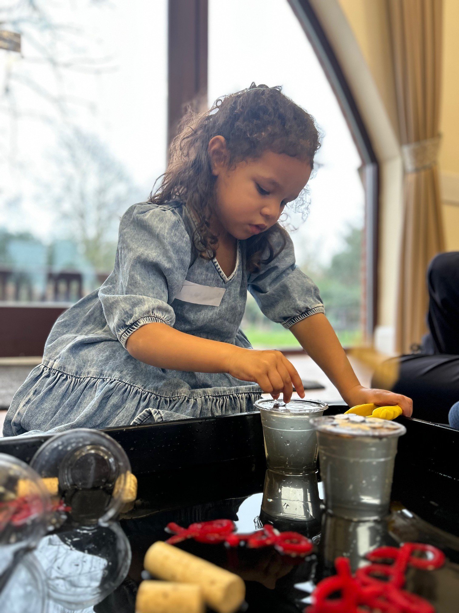 A young girl with curly hair
