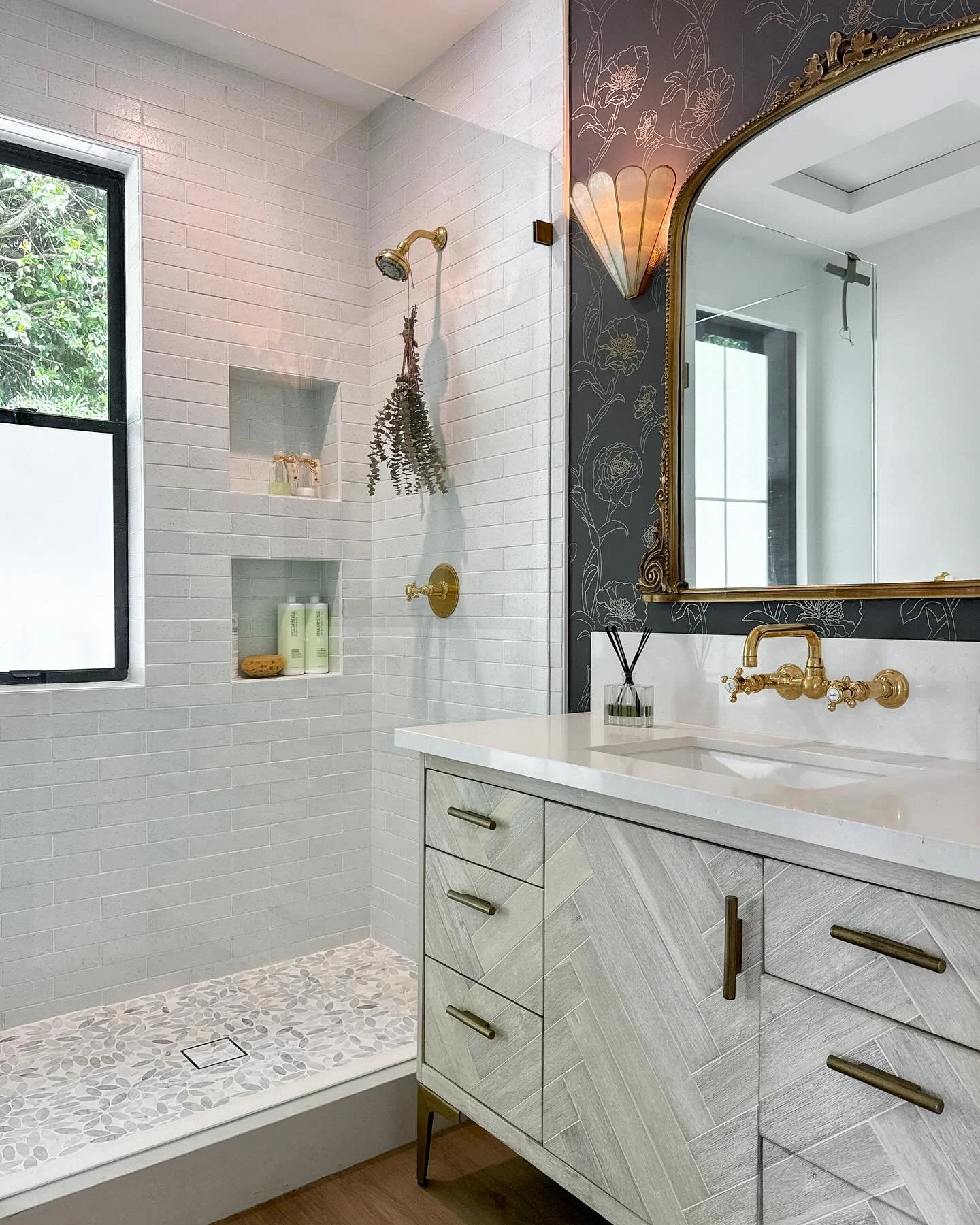 Something about this bathroom transports me to the French countryside 🌷 European charm, rustic elements, and understated elegance.