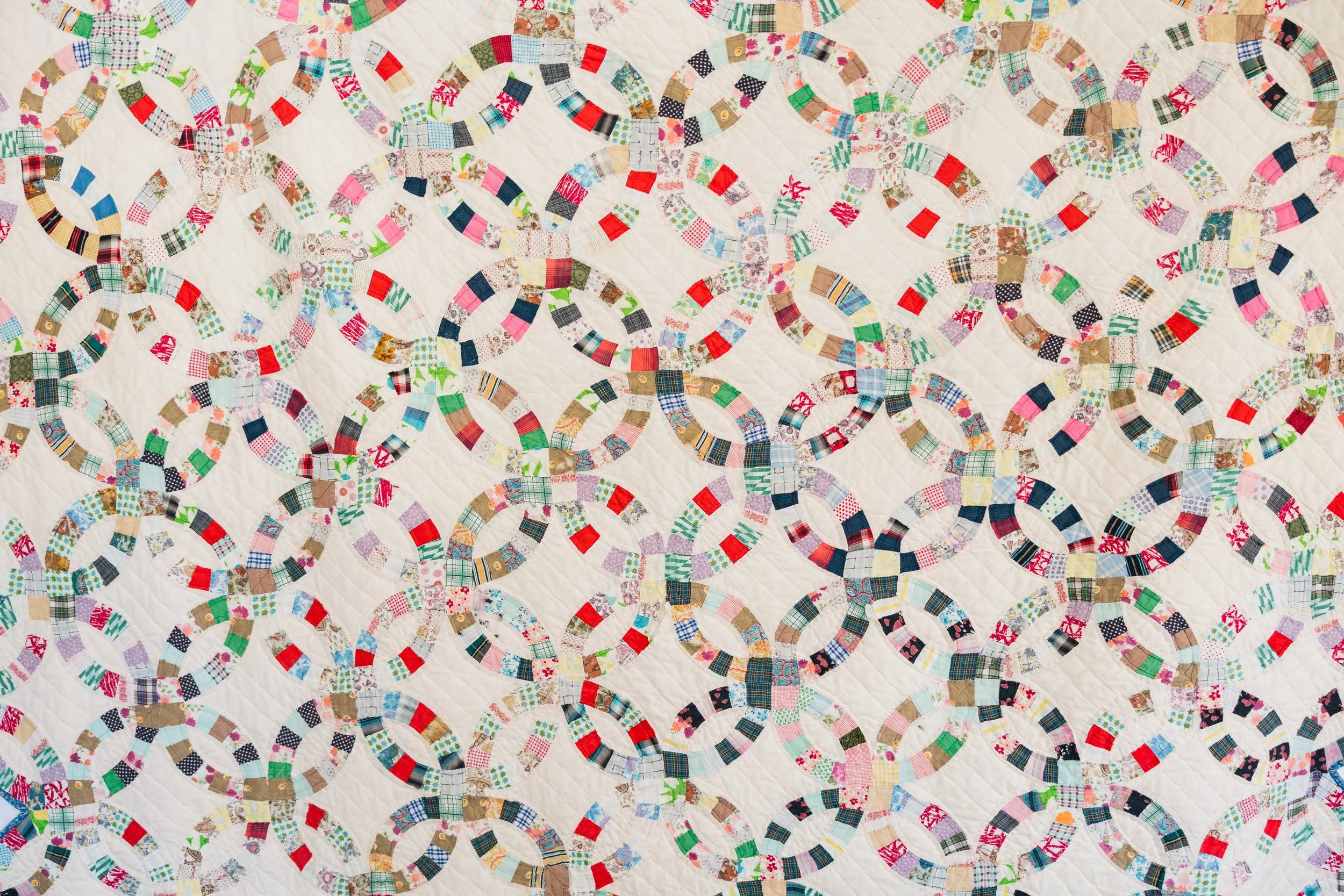 Rings Collection No. 5 - Multicolored Double Wedding Ring Quilt with Blue Floral Border